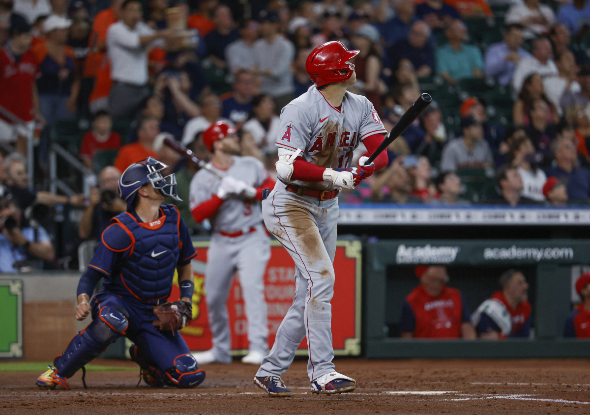 Apr 20, 2022; Houston, Texas, USA; Los Angeles Angels starting pitcher Shohei Ohtani (17) hits an RBI double during the first inning against the Houston Astros at Minute Maid Park. Mandatory Credit: Troy Taormina-USA TODAY Sports