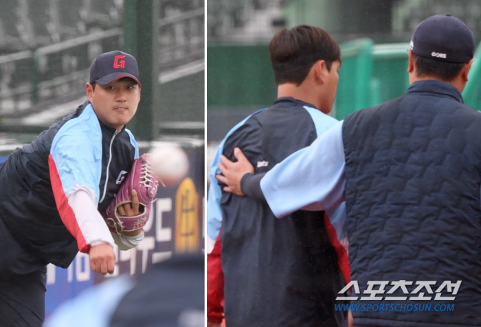비 맞으며 훈련하는 롯데 에이스 나균안, 등 쓰다듬는 코치 심정이 ‘이심…