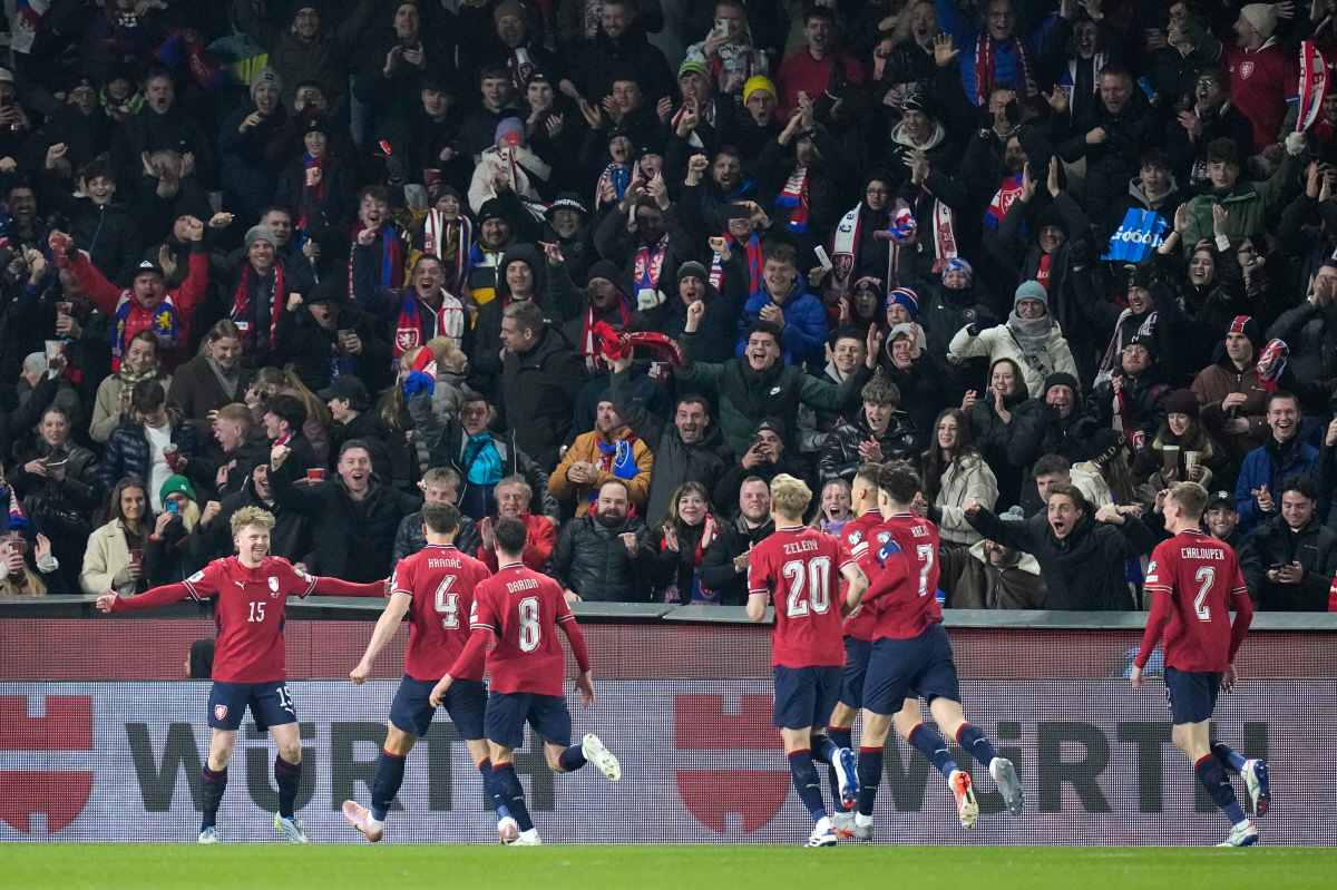 Czechia's Pavel Sulc, left, celebrates after scoring the opening goal during the World Cup qualifying playoff final soccer match between Czechia and Denmark in Prague, Tuesday, March 31, 2026. (AP Photo/Petr David Josek)