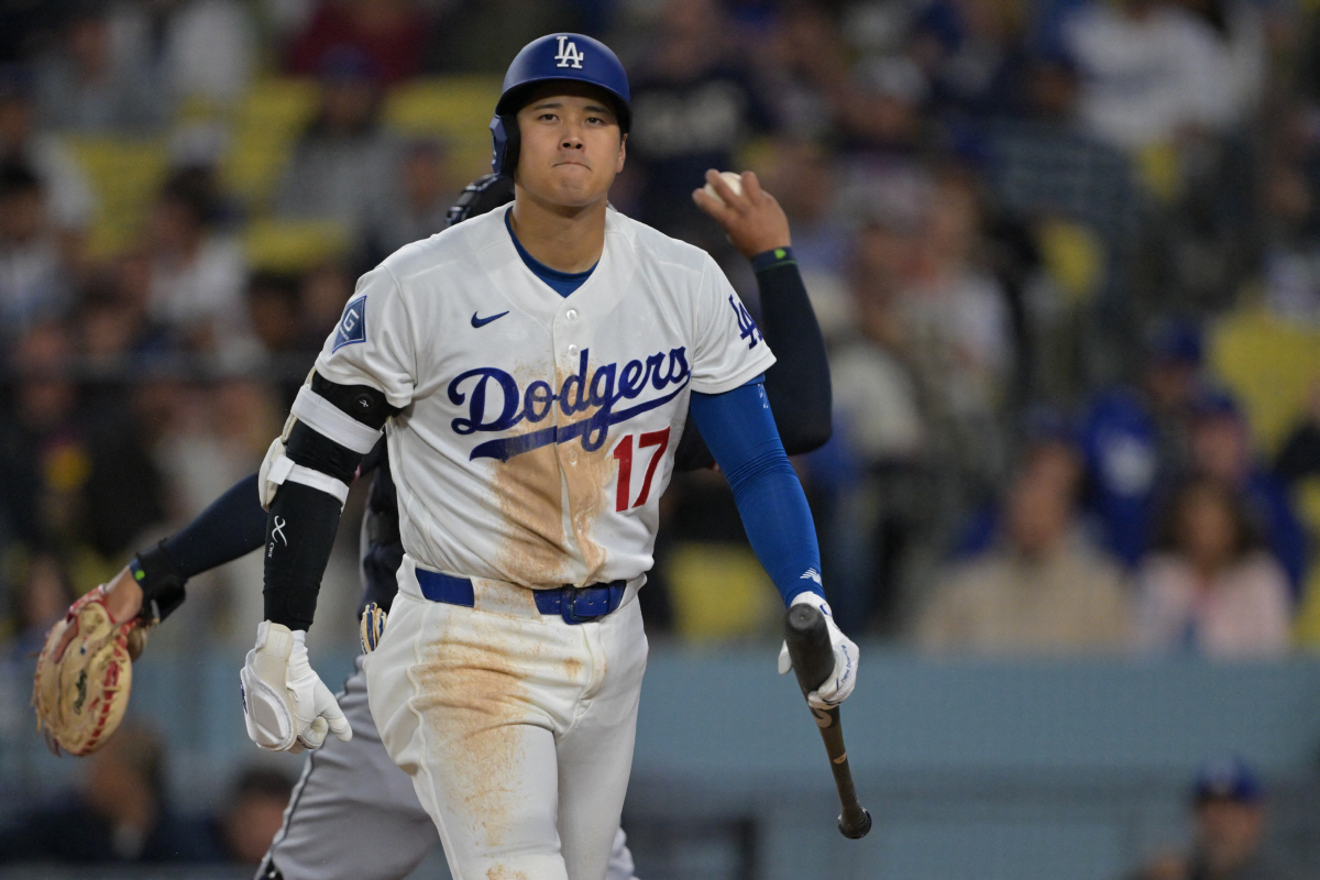 Apr 1, 2026; Los Angeles, California, USA; Los Angeles Dodgers two-way player Shohei Ohtani (17) returns to the dugout after he was called out on a checked swing with bases loaded to end in the eighth inning against the Cleveland Guardians at Dodger Stadium. Mandatory Credit: Jayne Kamin-Oncea-Imagn Images
