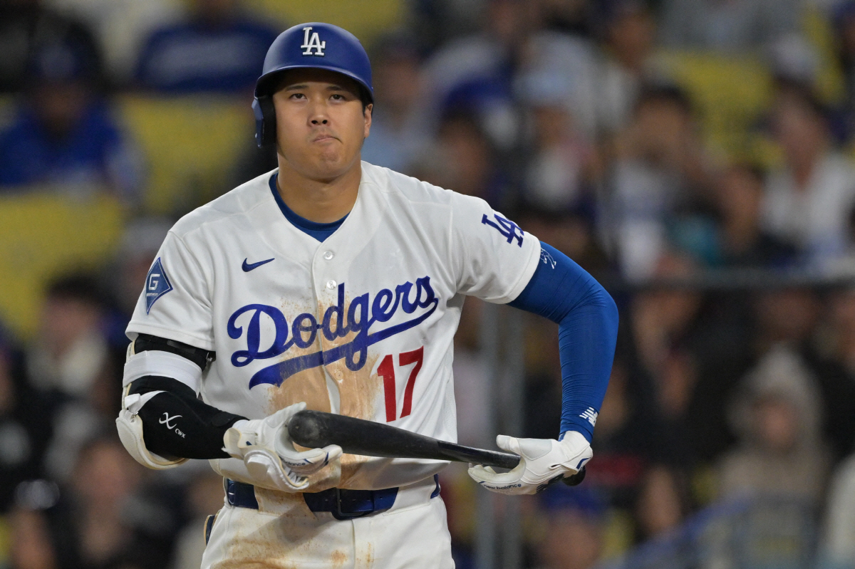 Apr 1, 2026; Los Angeles, California, USA; Los Angeles Dodgers two-way player Shohei Ohtani (17) reacts after he was called out on a checked swing with bases loaded to end in the eighth inning against the Cleveland Guardians at Dodger Stadium. Mandatory Credit: Jayne Kamin-Oncea-Imagn Images