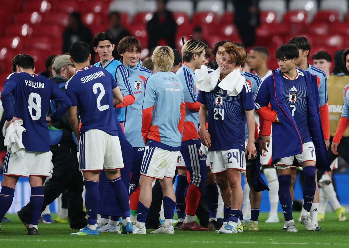 Soccer Football - International Friendly - England v Japan - Wembley Stadium, London, Britain- March 31, 2026 Japan's Kaishu Sano and Kaoru Mitoma celebrate after the match REUTERS/Isabel Infantes