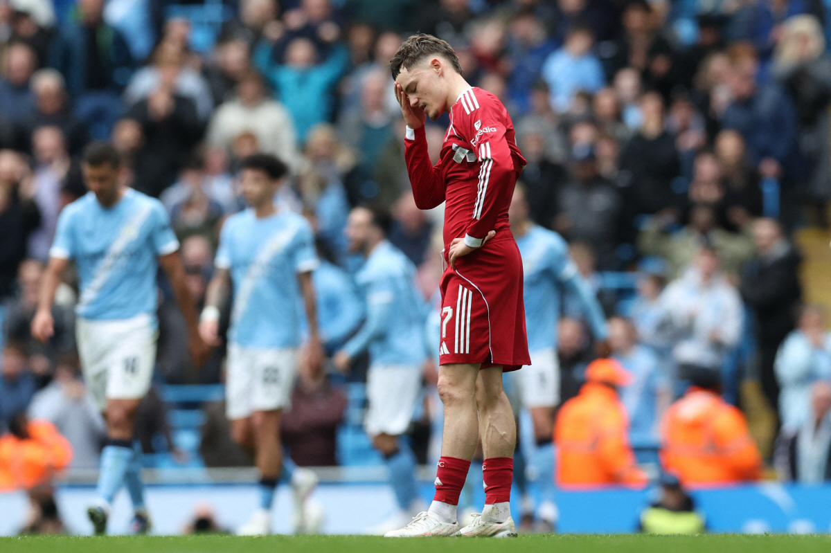 Liverpool's German midfielder #07 Florian Wirtz reacts after City score their second goal during the English FA Cup quarter final football match between Manchester City and Liverpool at the Etihad Stadium in Manchester, north west England, on April 4, 2026. (Photo by Darren Staples / AFP) / RESTRICTED TO EDITORIAL USE. No use with unauthorized audio, video, data, fixture lists, club/league logos or 'live' services. Online in-match use limited to 120 images. An additional 40 images may be used in extra time. No video emulation. Social media in-match use limited to 120 images. An additional 40 images may be used in extra time. No use in betting publications, games or single club/league/player publications. /