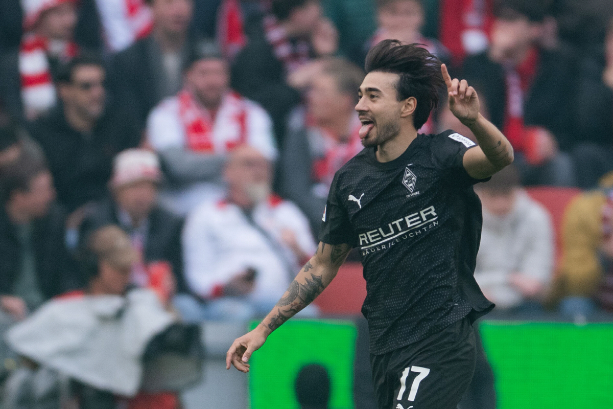 Gladbach's Jens Castrop celebrates after scoring his side's third goal during the German Bundesliga soccer match between 1. FC Cologne and Borussia Moenchengladbach in Cologne, Germany, Saturday, March 21, 2026. (Marius Becker/dpa via AP) THE DEUTSCHE FUSSBALL LIGA DFL DOES NOT ALLOW ITS IMAGES TO BE USED AS SEQUENCES TO EMULATE VIDEO; GERMANY OUT; MANDATORY CREDIT