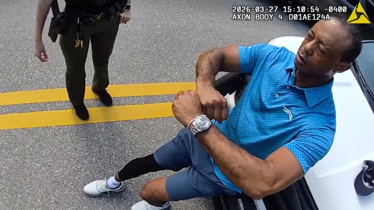 In this image taken from police body camera video released by the Martin County, Fla., Sheriff's Office, golfer Tiger Woods performs a field sobriety test for sheriff's deputies following a car crash in Jupiter Island, Fla., Friday, March 27, 2026. (Martin County Sheriff's Office via AP) AP PROVIDES ACCESS TO THIS PUBLICLY DISTRIBUTED HANDOUT PHOTO PROVIDED BY THE MARTIN COUNTY SHERIFF'S OFFICE; MANDATORY CREDIT. IMAGE TAKEN FROM POLICE BODY CAMERA VIDEO