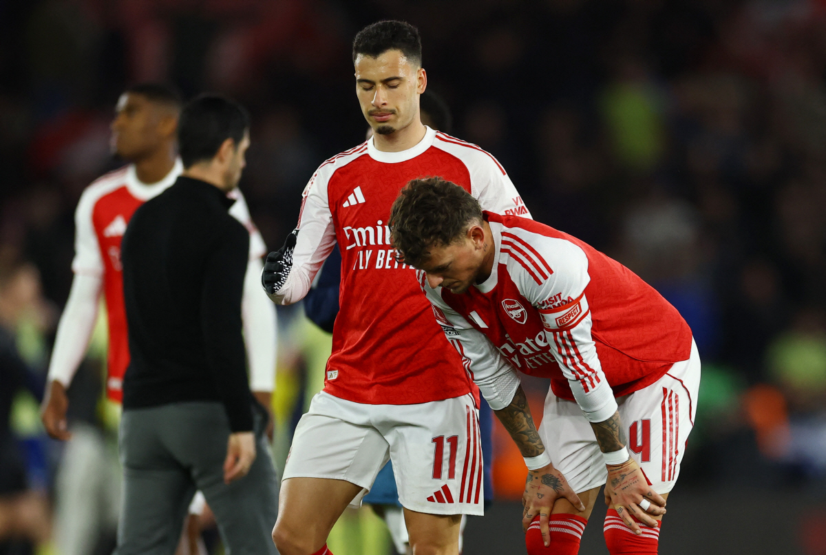 Soccer Football - FA Cup - Quarter Final - Southampton v Arsenal - St Mary's Stadium, Southampton, Britain - April 4, 2026 Arsenal's Ben White and Gabriel Martinelli look dejected after the match Action Images via Reuters/Matthew Childs