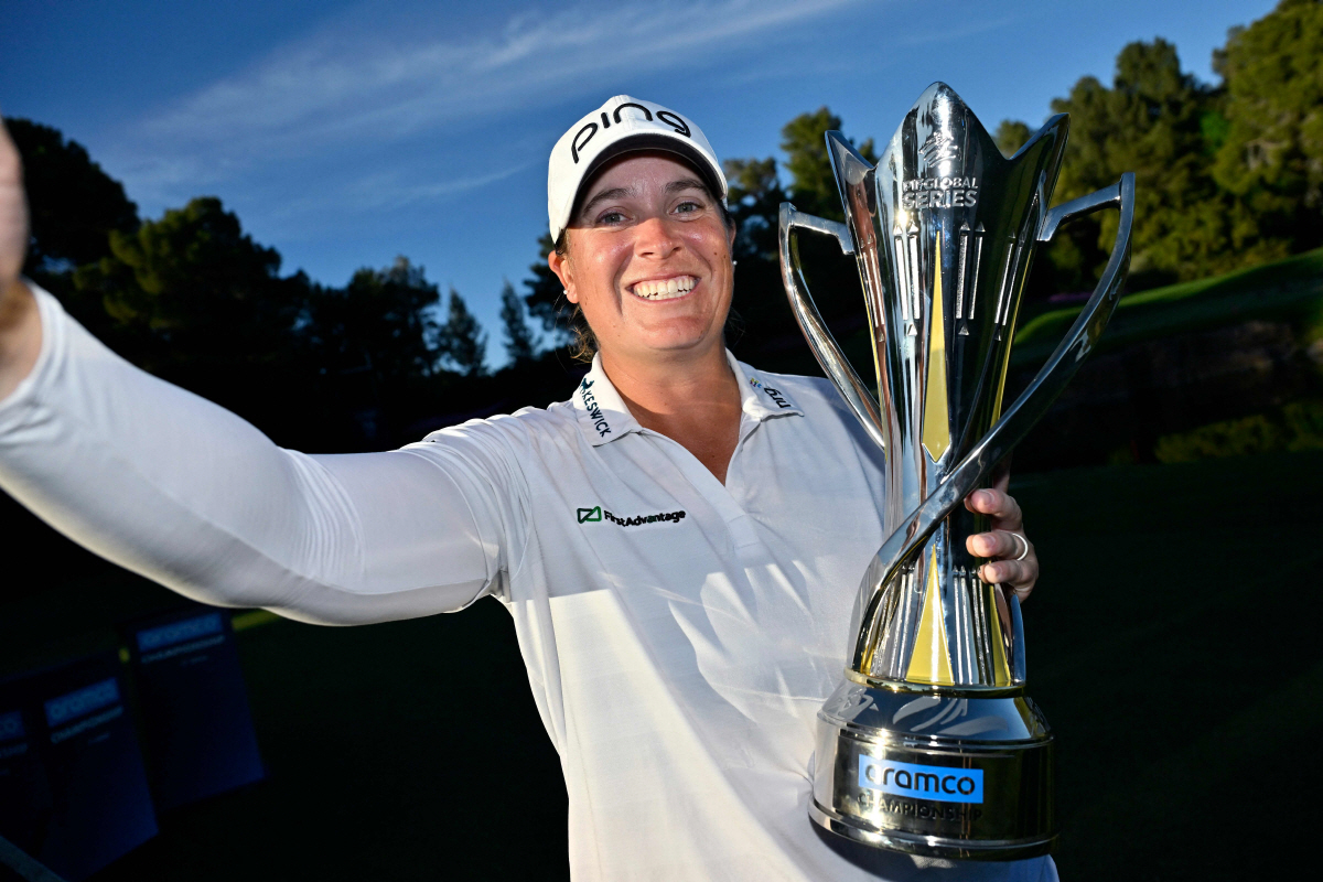 LAS VEGAS, NEVADA - APRIL 05: Lauren Coughlin of the United States imitates a selfie with the winner's trophy after the final round of the Aramco Championship 2026 at Shadow Creek Golf Course on April 05, 2026 in Las Vegas, Nevada. David Becker/Getty Images/AFP (Photo by David Becker / GETTY IMAGES NORTH AMERICA / Getty Images via AFP)