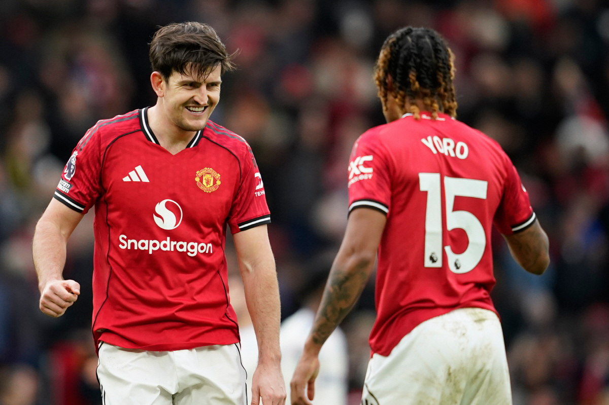 Manchester United's Harry Maguire and Leny Yoro react after the Premiier League soccer match between Manchester United and Aston Villa in Manchester, England, Sunday, March 15, 2026. (AP Photo/Dave Thompson)