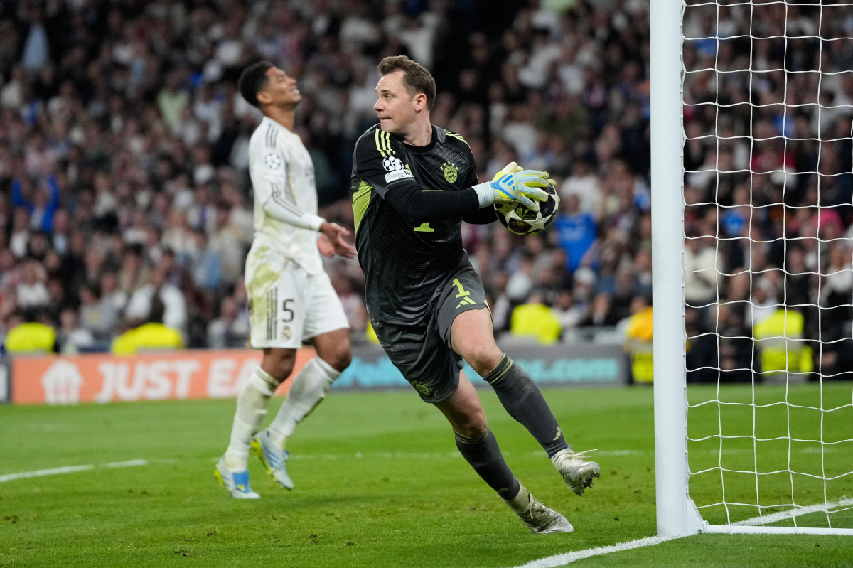Bayern's goalkeeper Manuel Neuer saves the ball during the Champions League quarterfinal first leg soccer match between Real Madrid and Bayern Munich in Madrid, Spain, Tuesday, April 7, 2026. (AP Photo/Bernat Armangue)
