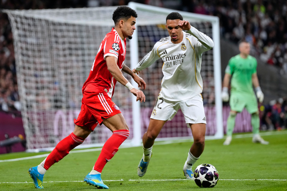 Bayern's Luis Diaz, left, and Real Madrid's Trent Alexander-Arnold vie for the ball during the Champions League quarterfinal first leg soccer match between Real Madrid and Bayern Munich in Madrid, Spain, Tuesday, April 7, 2026. (AP Photo/Jose Breton)