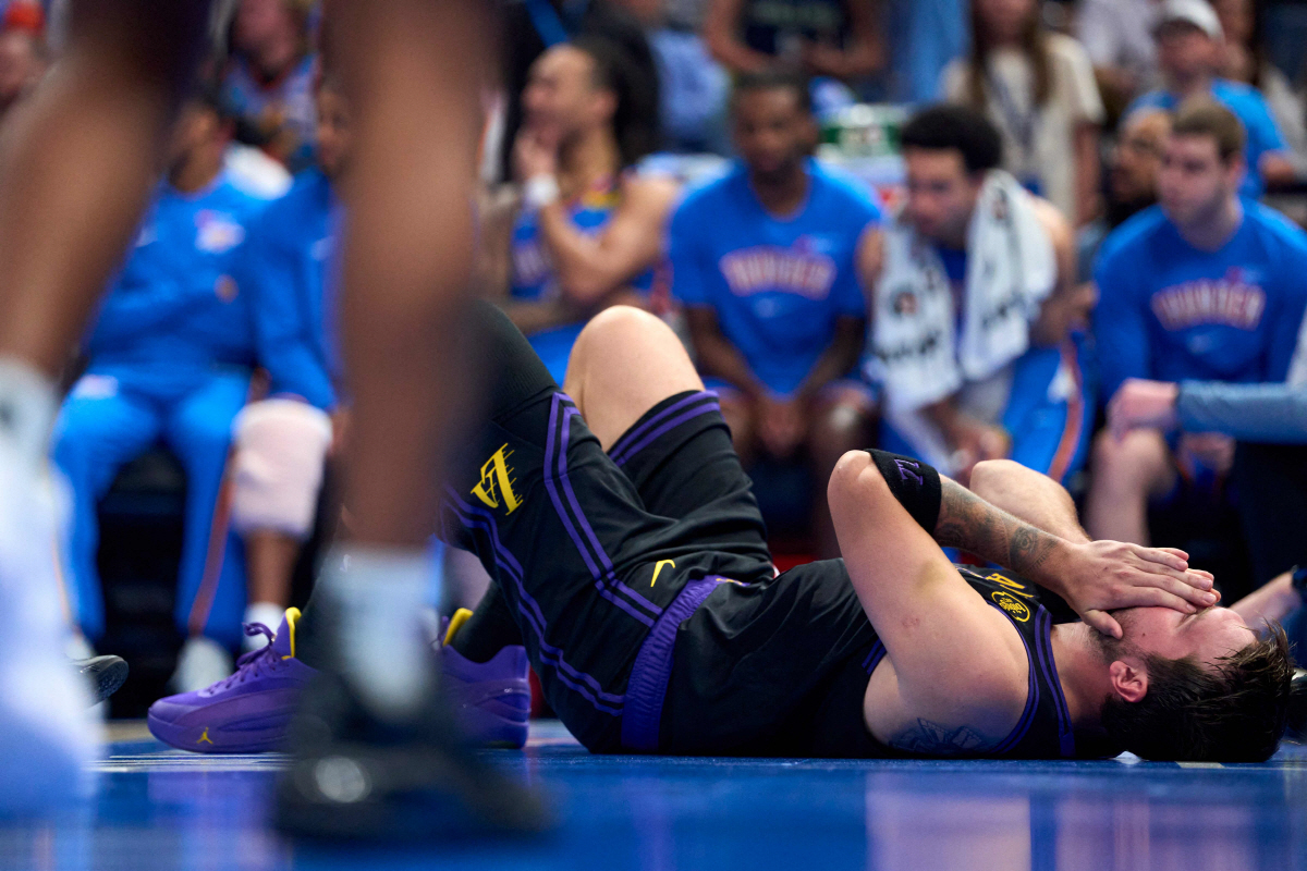 OKLAHOMA CITY, OKLAHOMA - APRIL 02: Luka Doncic #77 of the Los Angeles Lakers reacts from the floor after a play during the second half against the Oklahoma City Thunder at the Paycom Center on April 2, 2026 in Oklahoma City, Oklahoma. NOTE TO USER: User expressly acknowledges and agrees that, by downloading and or using this photograph, User is consenting to the terms and conditions of the Getty Images License Agreement. Cooper Neill/Getty Images/AFP (Photo by Cooper Neill / GETTY IMAGES NORTH AMERICA / Getty Images via AFP)