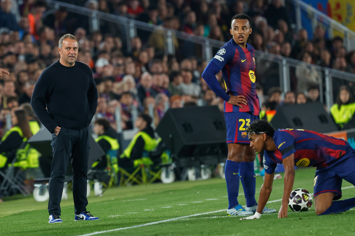 Barcelona's head coach Hansi Flick, left, Barcelona's Jules Kounde, Barcelona's Lamine Yamal during the Champions League quarterfinal first leg soccer match between Barcelona and Atletico Madrid in Barcelona, Spain, Wednesday, April 8, 2026. (AP Photo/Joan Monfort)