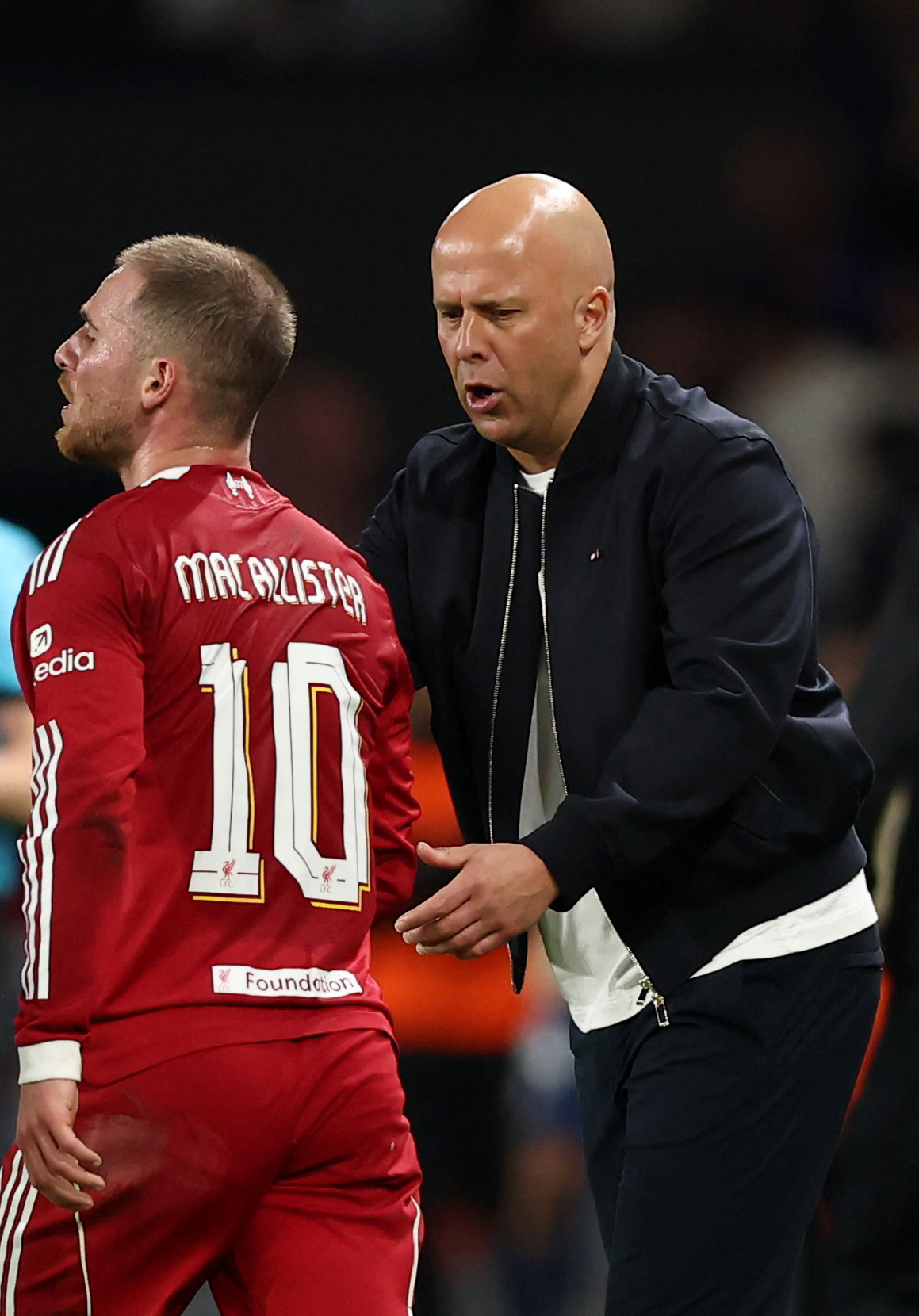 Soccer Football - UEFA Champions League - Quarter Final - First Leg - Paris St Germain v Liverpool - Parc des Princes, Paris, France - April 8, 2026 Liverpool's Alexis Mac Allister and manager Arne Slot REUTERS/Christian Hartmann