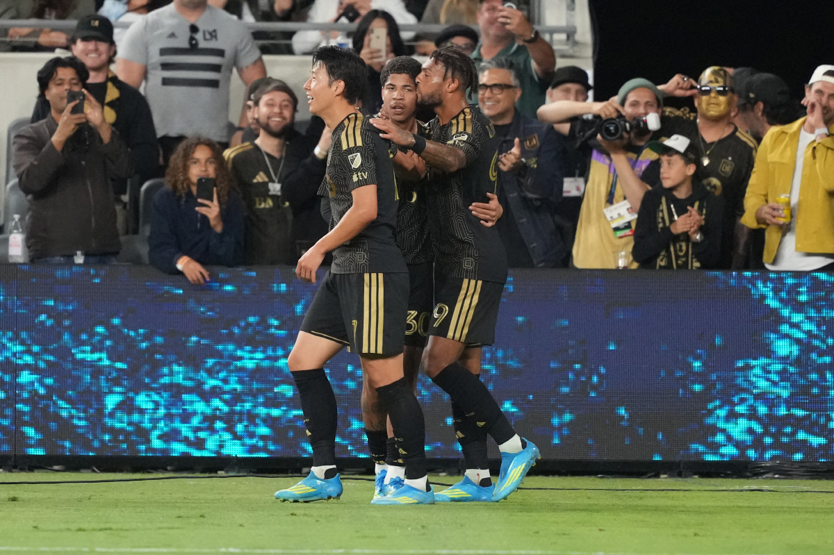 Apr 7, 2026; Los Angeles, CA, USA; LAFC forward David Martinez (30), center, celebrates with forward Son Heung-Min (7) and forward Denis Bouanga (99) after scoring a goal against Cruz Azul in the second half of a Concacaf Champions Cup quarterfinal at BMO Stadium. Mandatory Credit: Kirby Lee-Imagn Images