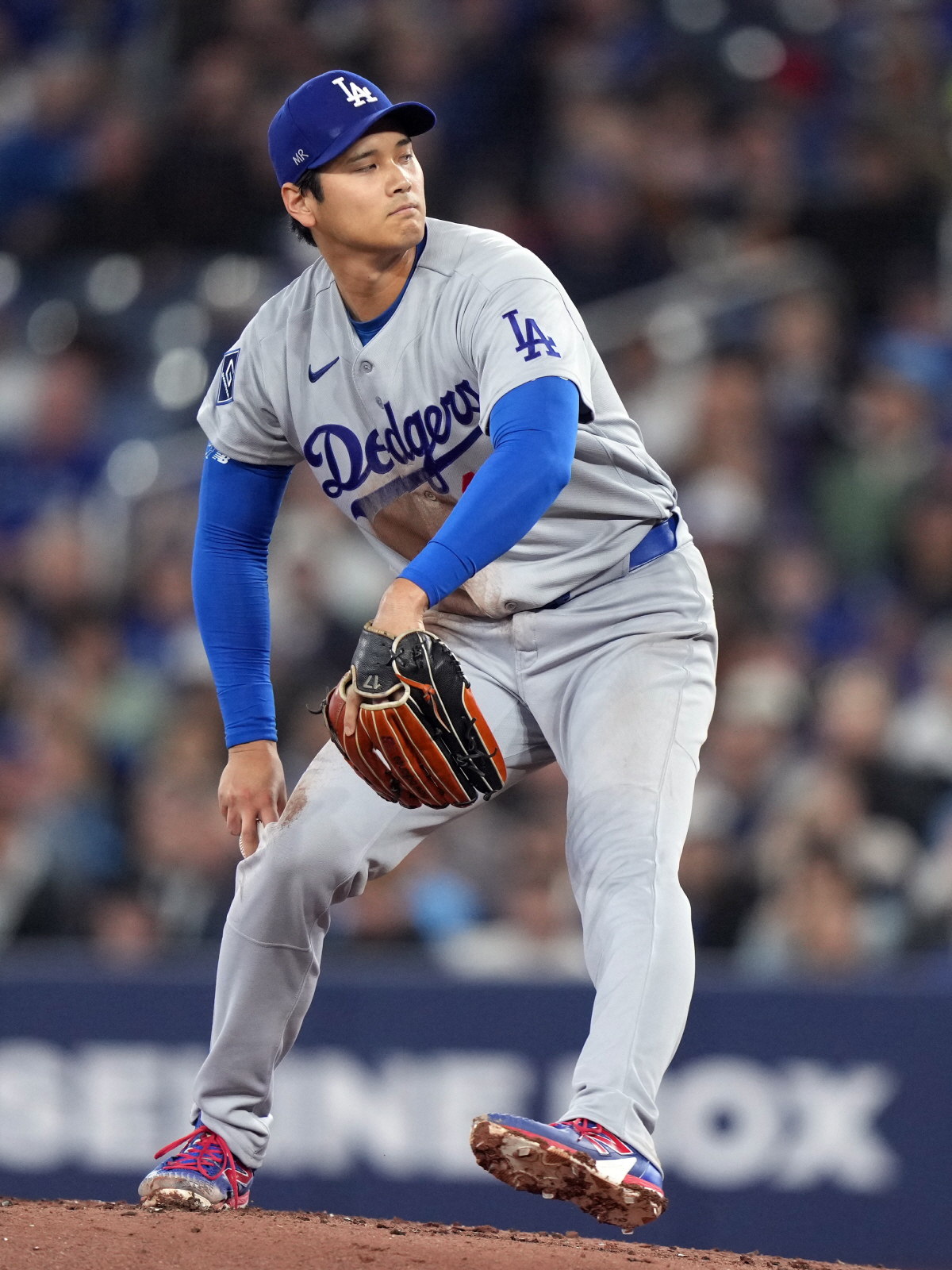Los Angeles Dodgers pitcher Shohei Ohtani (17) throws during first inning of a baseball against the Toronto Blue Jays in Toronto, Wednesday, April 8, 2026. (Nathan Denette/The Canadian Press via AP) MANDATORY CREDIT