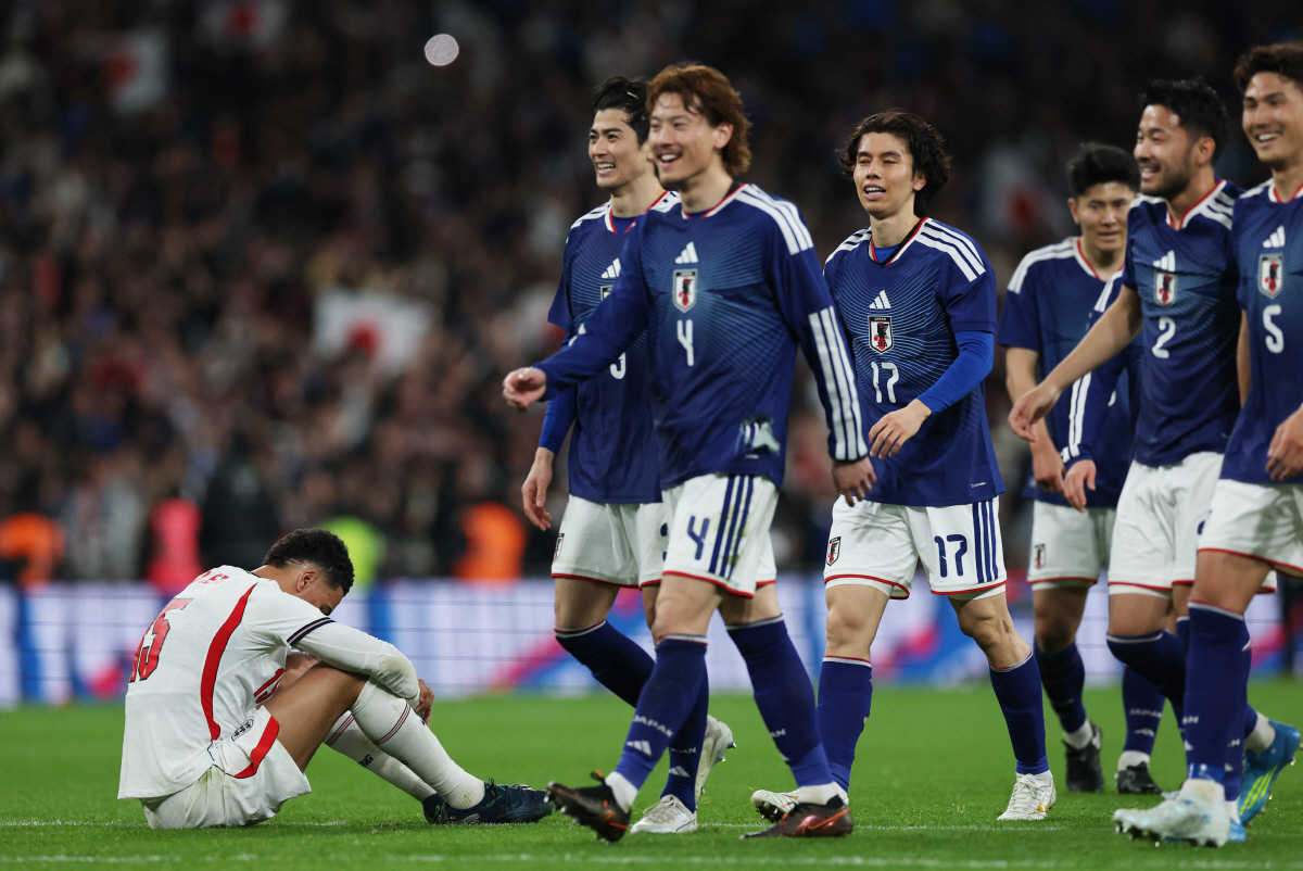 Soccer Football - International Friendly - England v Japan - Wembley Stadium, London, Britain- March 31, 2026 England's Morgan Rogers looks dejected as Japan's Ao Tanaka celebrates after the match Action Images via Reuters/Paul Childs