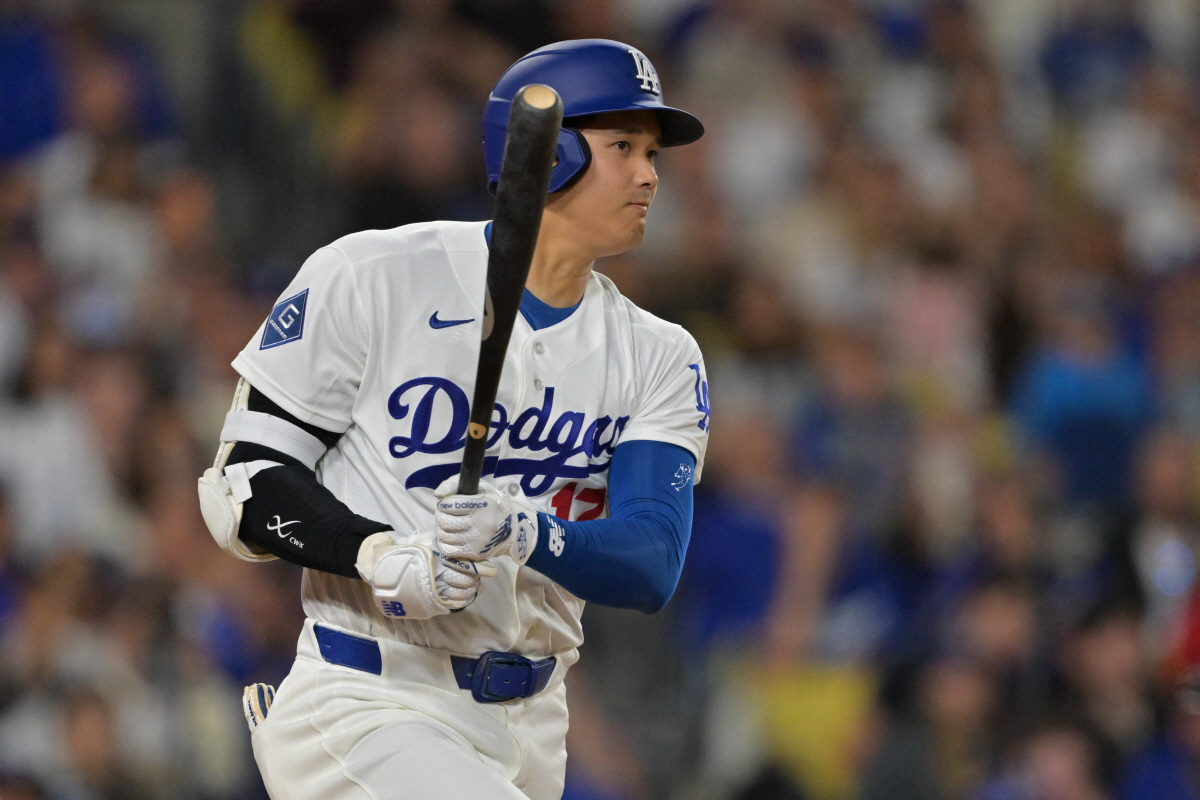 Apr 10, 2026; Los Angeles, California, USA; Los Angeles Dodgers two-way player Shohei Ohtani (17) singles in the fifth inning against the Texas Rangers at Dodger Stadium. Mandatory Credit: Jayne Kamin-Oncea-Imagn Images