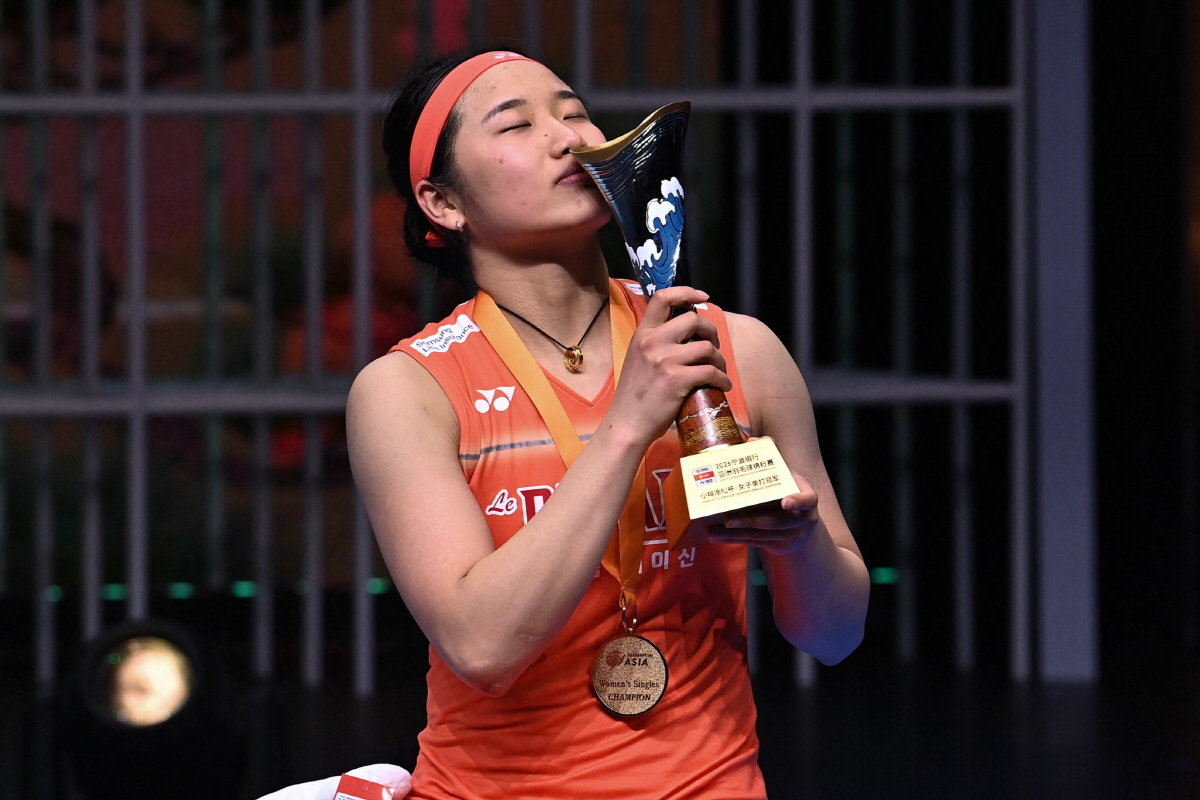 Gold medallist South Korea's An Se-young celebrates on the podium during the award ceremony for the women's singles final match at the Badminton Asia Championship in Ningbo, eastern China's Zhejiang province on April 12, 2026. (Photo by CN-STR / AFP) / China OUT