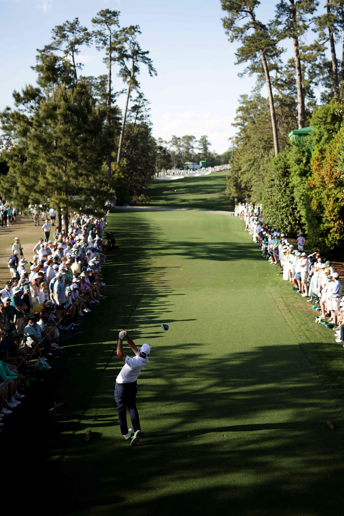 AUGUSTA, GEORGIA - APRIL 12: Scottie Scheffler of the United States plays his shot from the 18th tee during the final round of the 2026 Masters Tournament at Augusta National Golf Club on April 12, 2026 in Augusta, Georgia. Jared C. Tilton/Getty Images/AFP (Photo by Jared C. Tilton / GETTY IMAGES NORTH AMERICA / Getty Images via AFP)