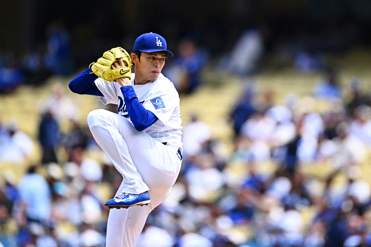 Apr 12, 2026; Los Angeles, California, USA; Los Angeles Dodgers pitcher Roki Sasaki (11) throws a pitch during the first inning against the Texas Rangers at Dodger Stadium. Mandatory Credit: Jonathan Hui-Imagn Images