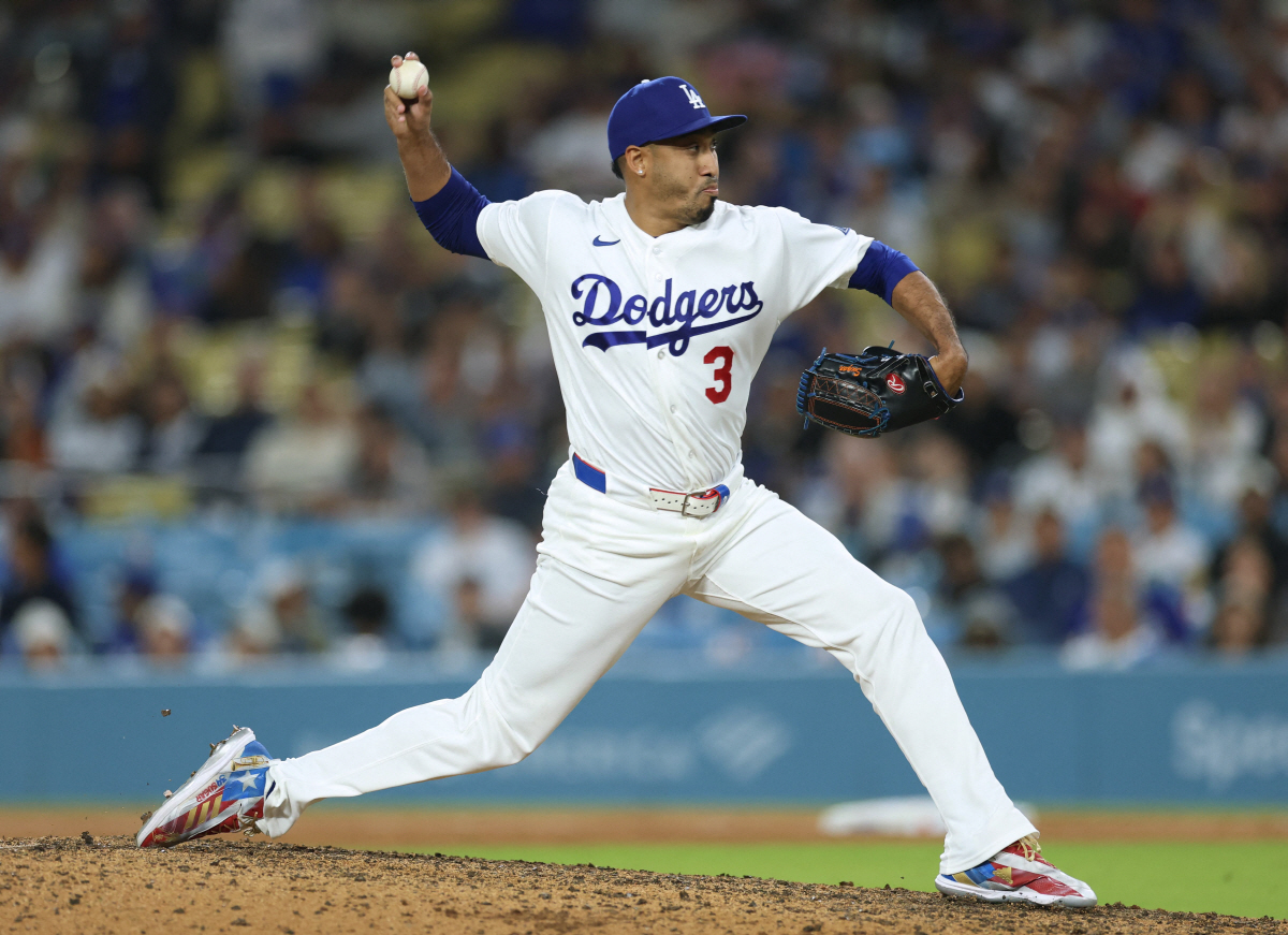LOS ANGELES, CALIFORNIA - APRIL 10: Edwin Diaz #3 of the Los Angeles Dodgers pitches in relief against the Texas Rangers during the ninth inning at Dodger Stadium on April 10, 2026 in Los Angeles, California. Harry How/Getty Images/AFP (Photo by Harry How / GETTY IMAGES NORTH AMERICA / Getty Images via AFP)