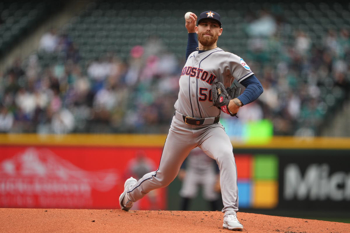 Houston Astros starting pitcher Mike Burrows throws against the Seattle Mariners during the first inning of a baseball game, Monday, April 13, 2026, in Seattle. (AP Photo/Lindsey Wasson)