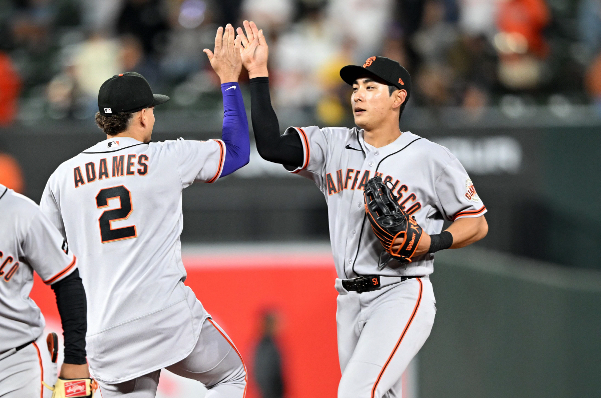 BALTIMORE, MARYLAND - APRIL 10: Willy Adames #2 and Jung Hoo Lee #51 of the San Francisco Giants celebrate after a 6-3 victory against the Baltimore Orioles at Oriole Park at Camden Yards on April 10, 2026 in Baltimore, Maryland. Greg Fiume/Getty Images/AFP (Photo by Greg Fiume / GETTY IMAGES NORTH AMERICA / Getty Images via AFP)