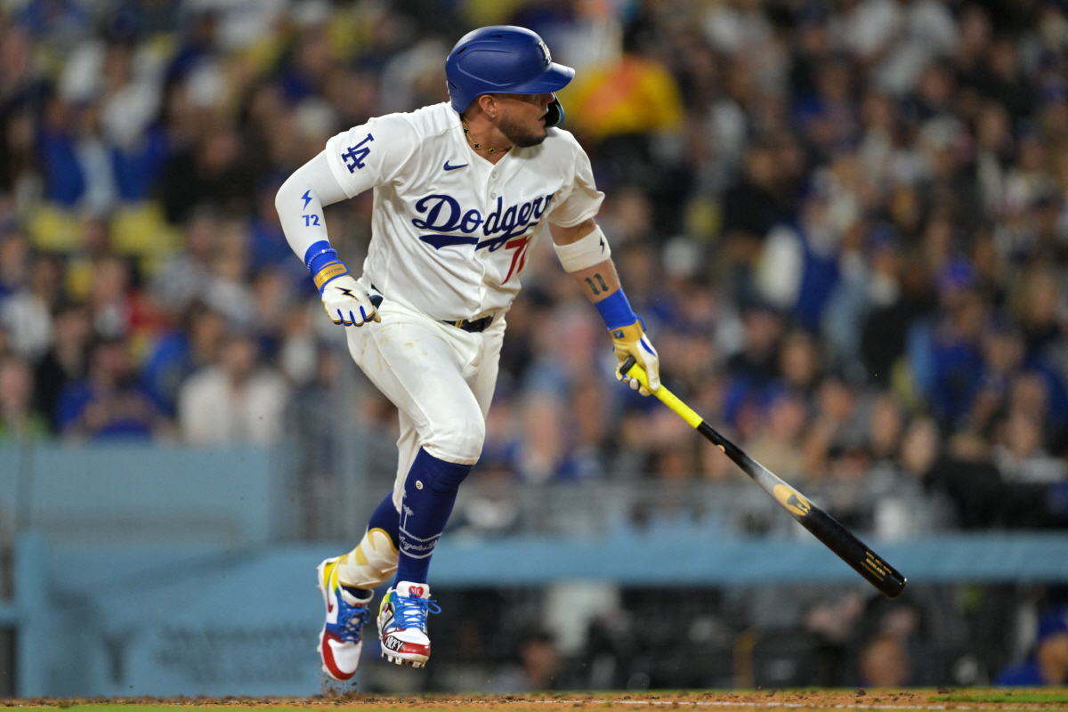 Apr 10, 2026; Los Angeles, California, USA; Los Angeles Dodgers second baseman Miguel Rojas (72) singles in the sixth inning against the Texas Rangers at Dodger Stadium. Mandatory Credit: Jayne Kamin-Oncea-Imagn Images