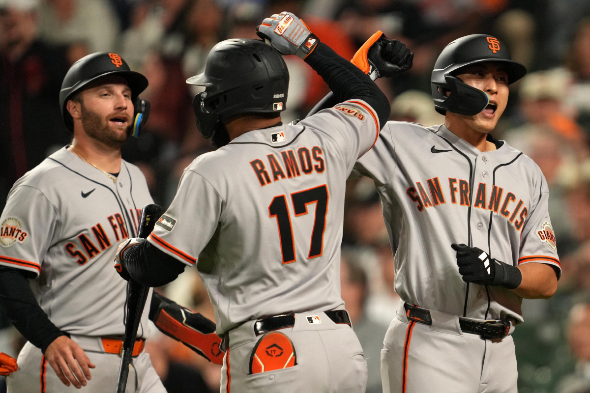 Apr 10, 2026; Baltimore, Maryland, USA; San Francisco Giants outfielder Jung Hoo Lee (right) greeted by designated hitter Casey Schmitt (left) and outfielder Heliot Ramons (center) following his two run home run during the seventh inning against the Baltimore Orioles at Oriole Park at Camden Yards. Mandatory Credit: Mitch Stringer-Imagn Images