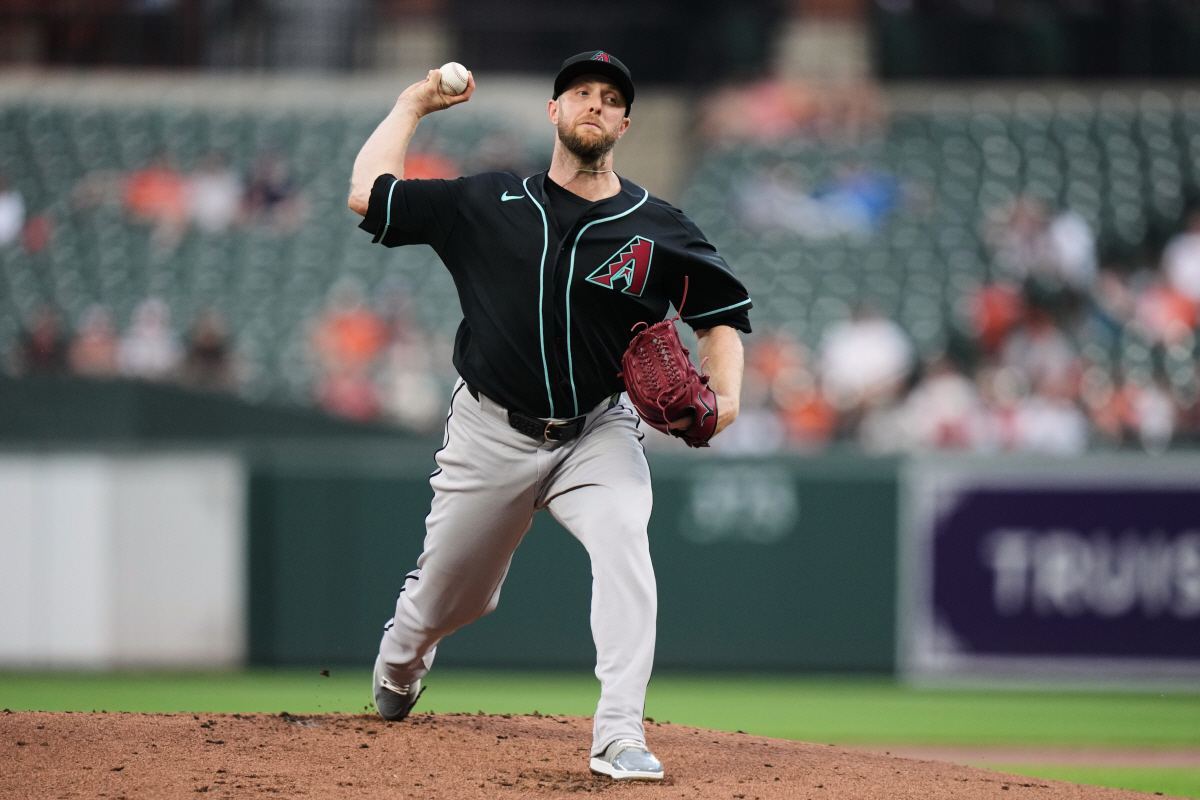 Arizona Diamondbacks starting pitcher Merrill Kelly delivers during the first inning of a baseball game against the Baltimore Orioles, Tuesday, April 14, 2026, in Baltimore. (AP Photo/Stephanie Scarbrough)