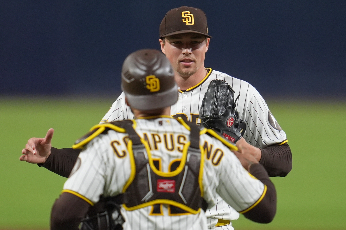 San Diego Padres pitcher Mason Miller, above, celebrates with catcher Luis Campusano after the Padres defeated the Seattle Mariners 4-1 in a baseball game Tuesday, April 14, 2026, in San Diego. (AP Photo/Gregory Bull)