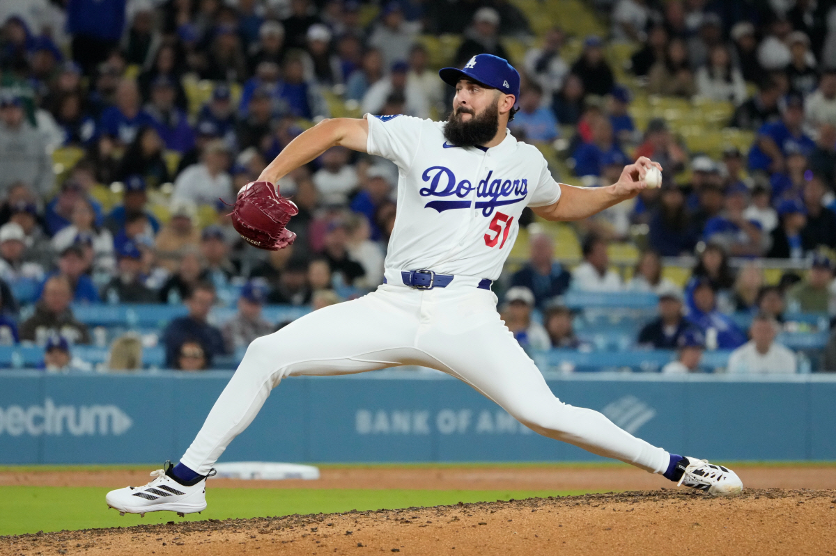 Los Angeles Dodgers relief pitcher Alex Vesia throws to the plate during the ninth inning of a baseball game against the New York Mets, Tuesday, April 14, 2026, in Los Angeles. (AP Photo/Mark J. Terrill)