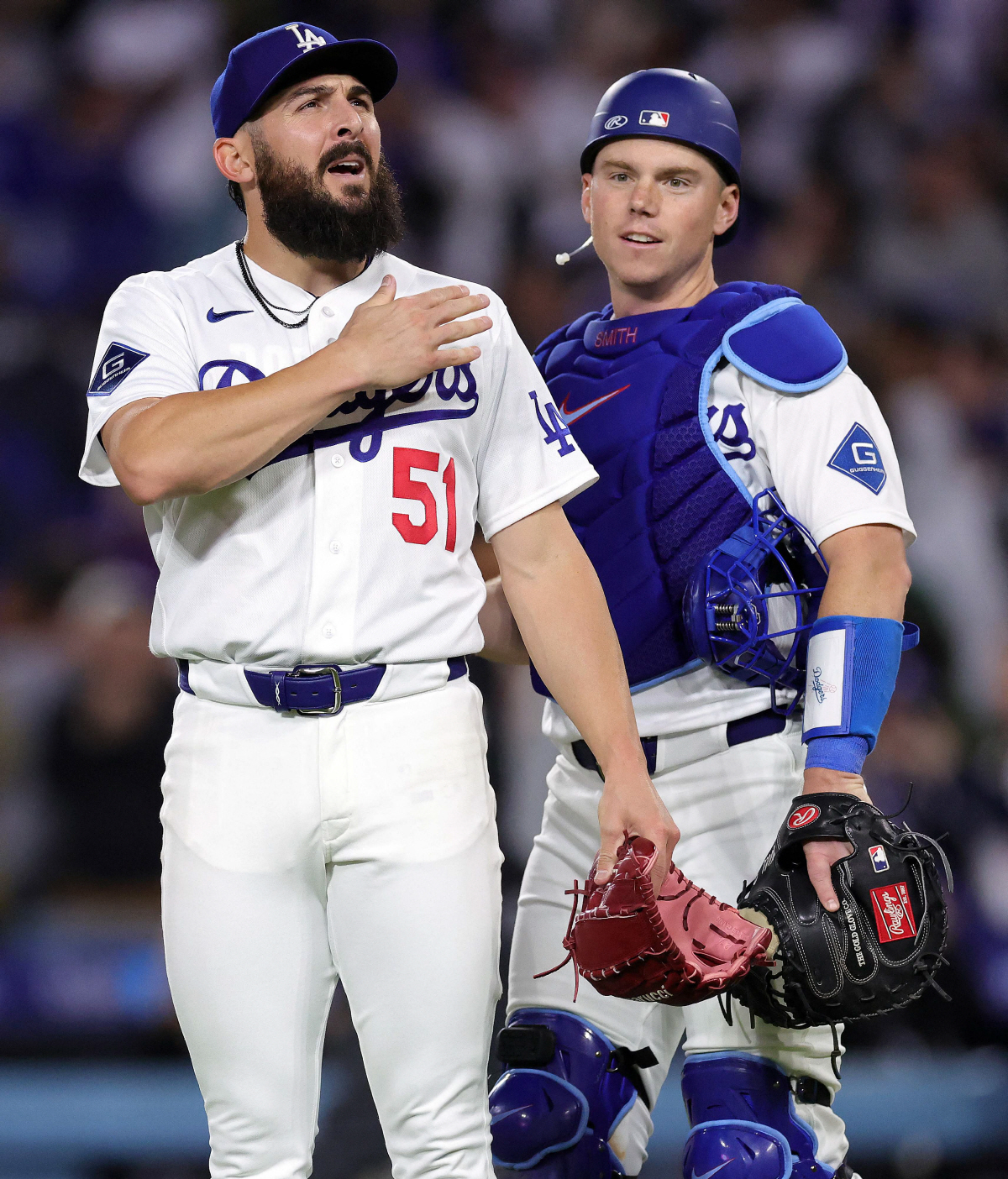 LOS ANGELES, CALIFORNIA - APRIL 14: Alex Vesia #51 and Will Smith #16 of the Los Angeles Dodgers celebrate a 2-1 win against the New York Mets at Dodger Stadium on April 14, 2026 in Los Angeles, California. Ronald Martinez/Getty Images/AFP (Photo by RONALD MARTINEZ / GETTY IMAGES NORTH AMERICA / Getty Images via AFP)