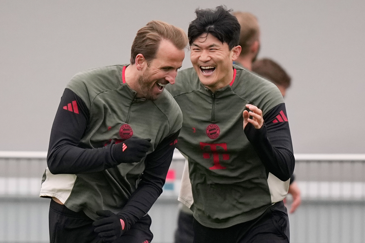 Bayern's Kim Min-jae and Bayern's Harry Kane having fun during a training session ahead of the Champions League quarterfinal second leg soccer match between Bayern Munich and Real Madrid in Munich, Germany, Tuesday, April 14, 2026. (AP Photo/Matthias Schrader)