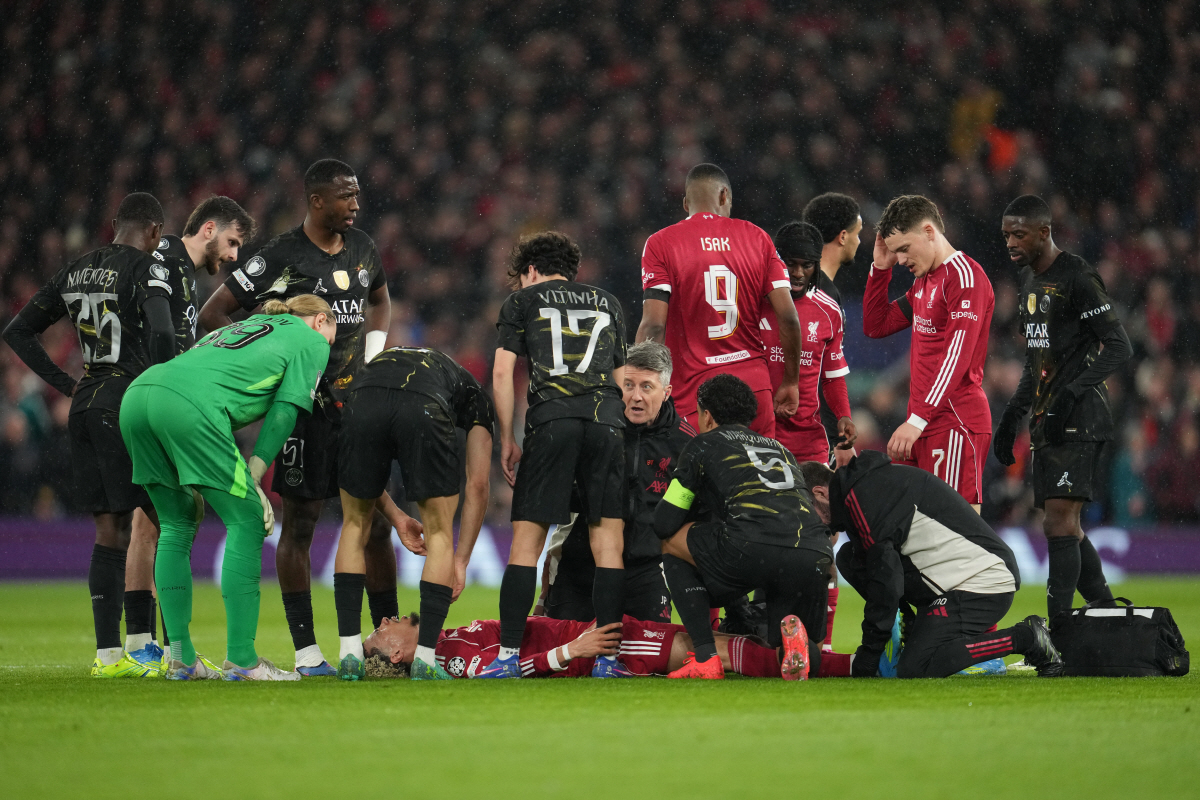Liverpool's Hugo Ekitike lies injured during the Champions League quarterfinal second leg soccer match between Liverpool and Paris Saint-Germain in Liverpool, England, Tuesday, April 14, 2026. (AP Photo/Jon Super)