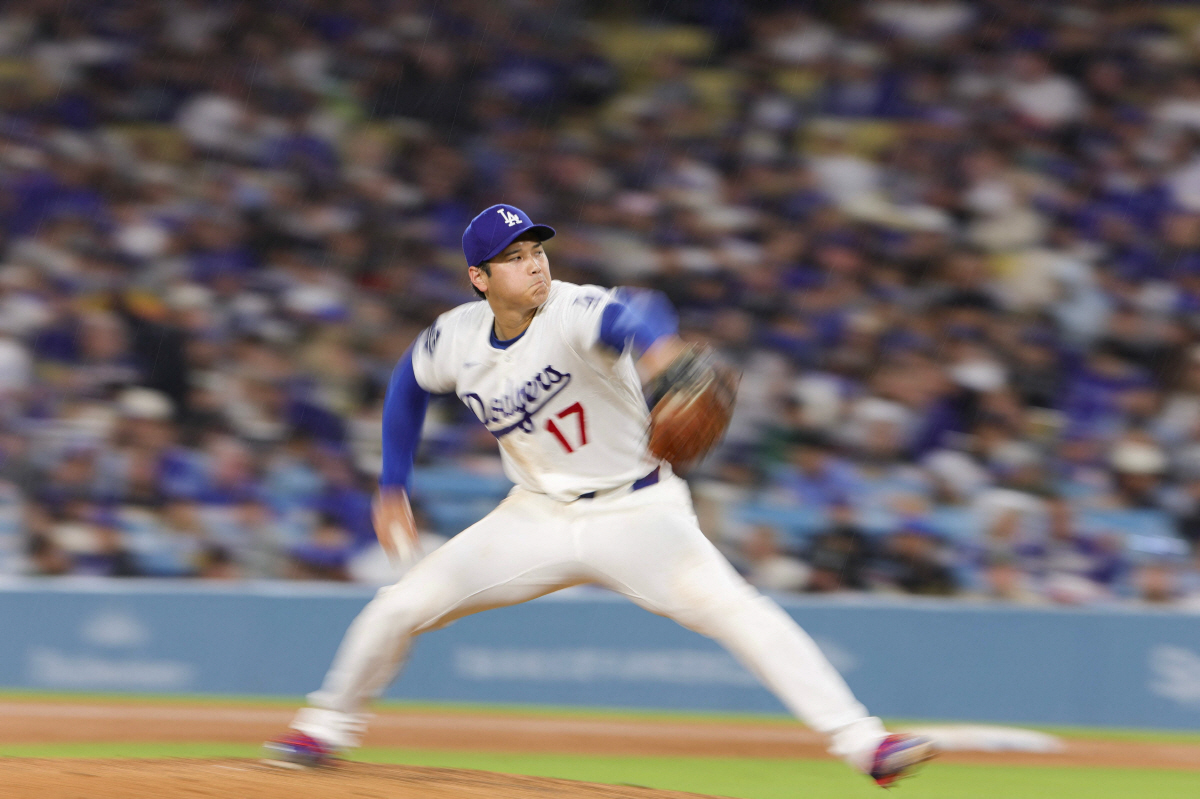 LOS ANGELES, CALIFORNIA - MARCH 31: Shohei Ohtani #17 of the Los Angeles Dodgers pitches during the fourth inning of a baseball game against the Cleveland Guardians at Dodger Stadium on March 31, 2026 in Los Angeles, California. Ryan Sirius Sun/Getty Images/AFP (Photo by Ryan Sirius Sun / GETTY IMAGES NORTH AMERICA / Getty Images via AFP)
