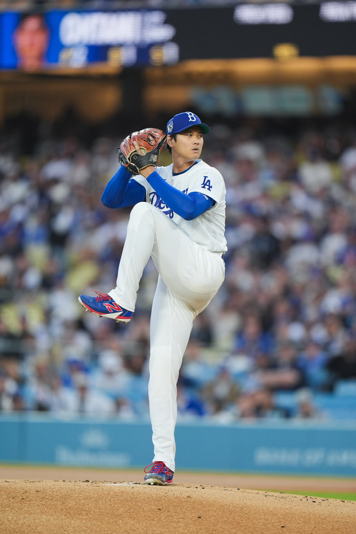 Los Angeles Dodgers starting pitcher Shohei Ohtani winds up to throw against the New York Mets during the first inning of a baseball game Wednesday, April 15, 2026, in Los Angeles. (AP Photo/Jae C. Hong)