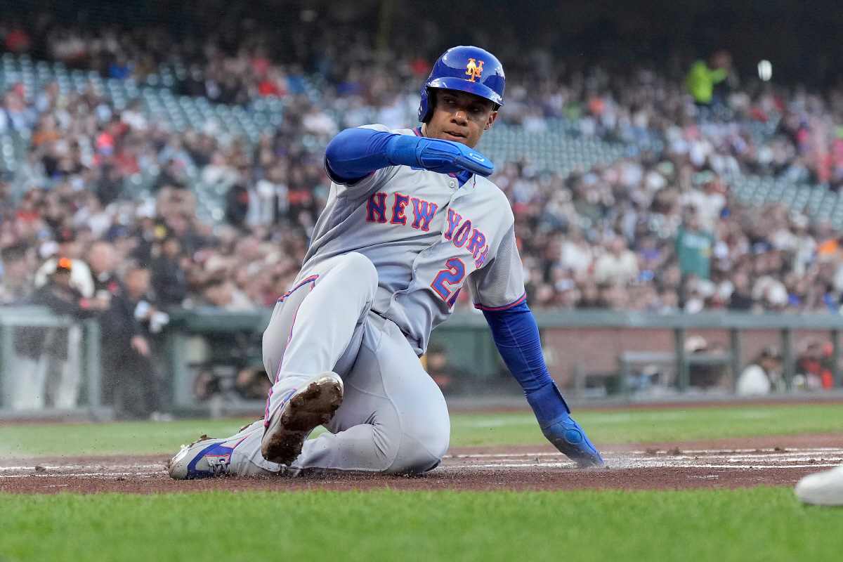 New York Mets' Juan Soto slides into home plate to score on a double by Bo Bichette during the first inning of a baseball game against the San Francisco Giants in San Francisco, Thursday, April 2, 2026. (AP Photo/Tony Avelar)