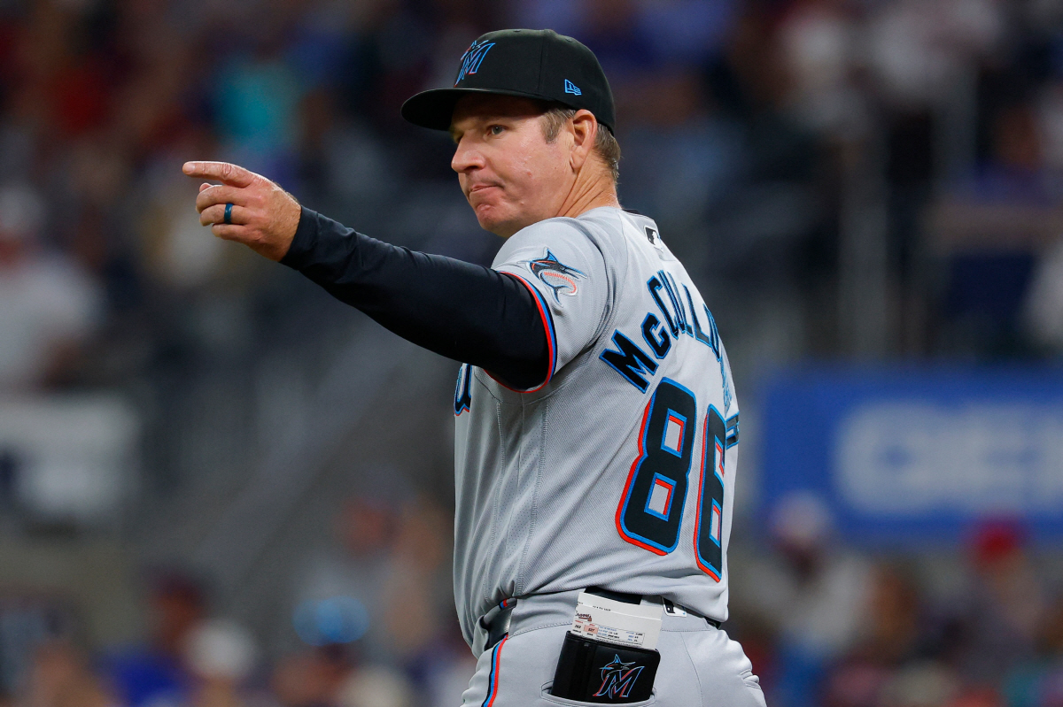 ATLANTA, GEORGIA - APRIL 13: Manager Clayton McCullough #86 of the Miami Marlins makes a pitching change during the fifth inning against the Atlanta Braves at Truist Park on April 13, 2026 in Atlanta, Georgia. Todd Kirkland/Getty Images/AFP (Photo by Todd Kirkland / GETTY IMAGES NORTH AMERICA / Getty Images via AFP)