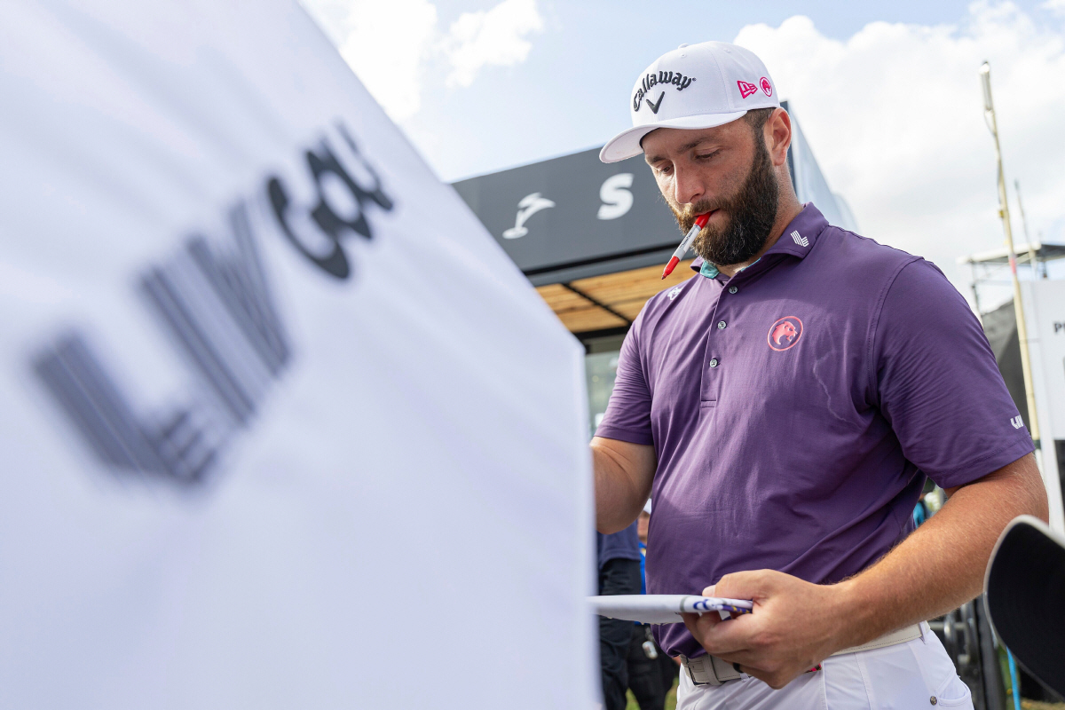 FILE - Captain Jon Rahm of Legion XIII signs autographs after the first round of LIV Golf tournament at Trump National Doral, April 4, 2025 in Miami. (Photo by Scott Taetsch/LIV Golf via AP, File) FILE PHOTO MANDATORY CREDIT