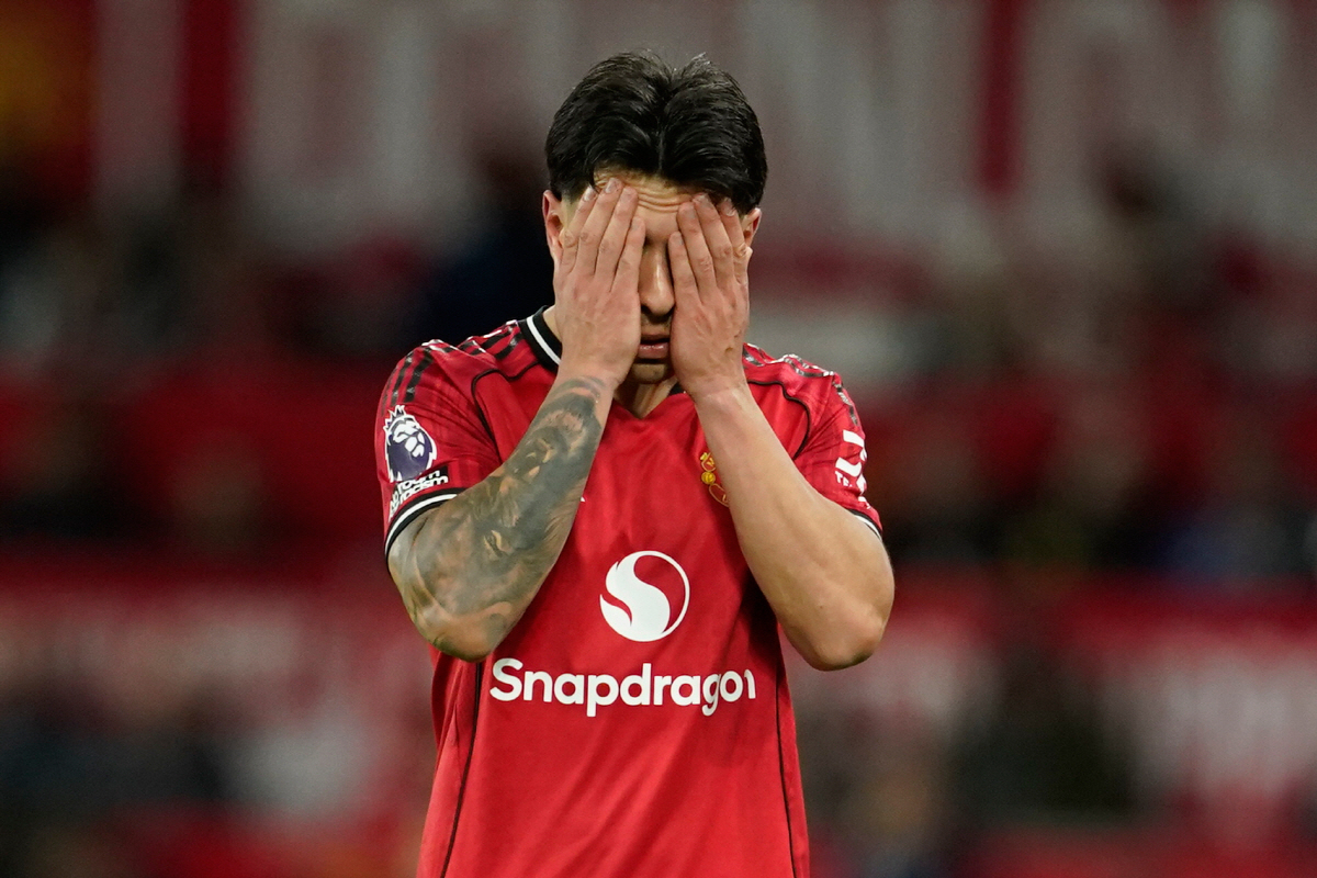 Manchester United's Lisandro Martinez reacts after receiveng a red card during the Premiier League soccer match between Manchester United and Leeds in Manchester, England, Monday, April 13, 2026. (AP Photo/Dave Thompson)