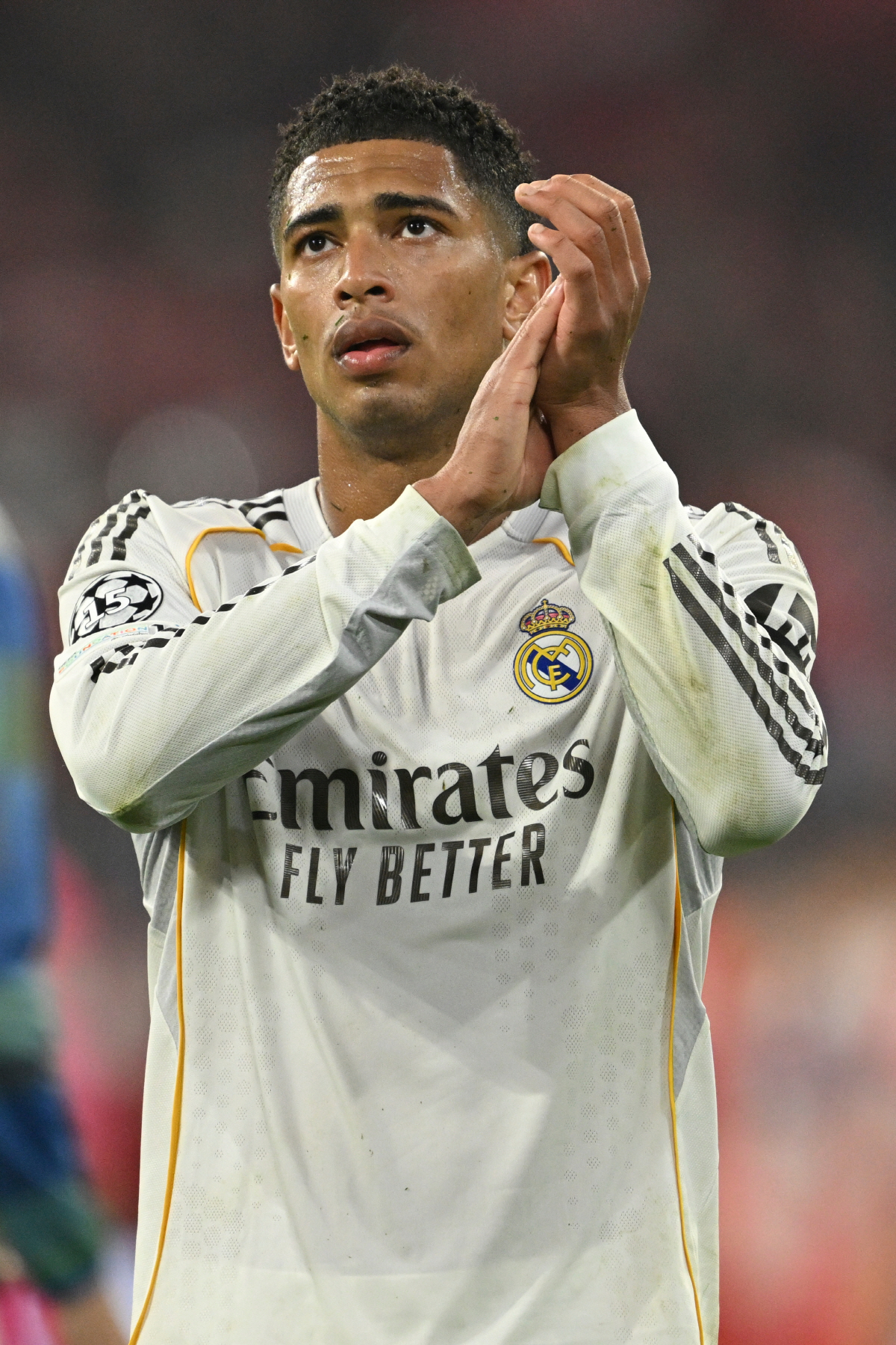 Real Madrid's Jude Bellingham applauds supporters at the end of the Champions League quarterfinal second leg soccer match between Bayern Munich and Real Madrid in Munich, Germany, Wednesday, April 15, 2026. (AP Photo/Lennart Preiss)