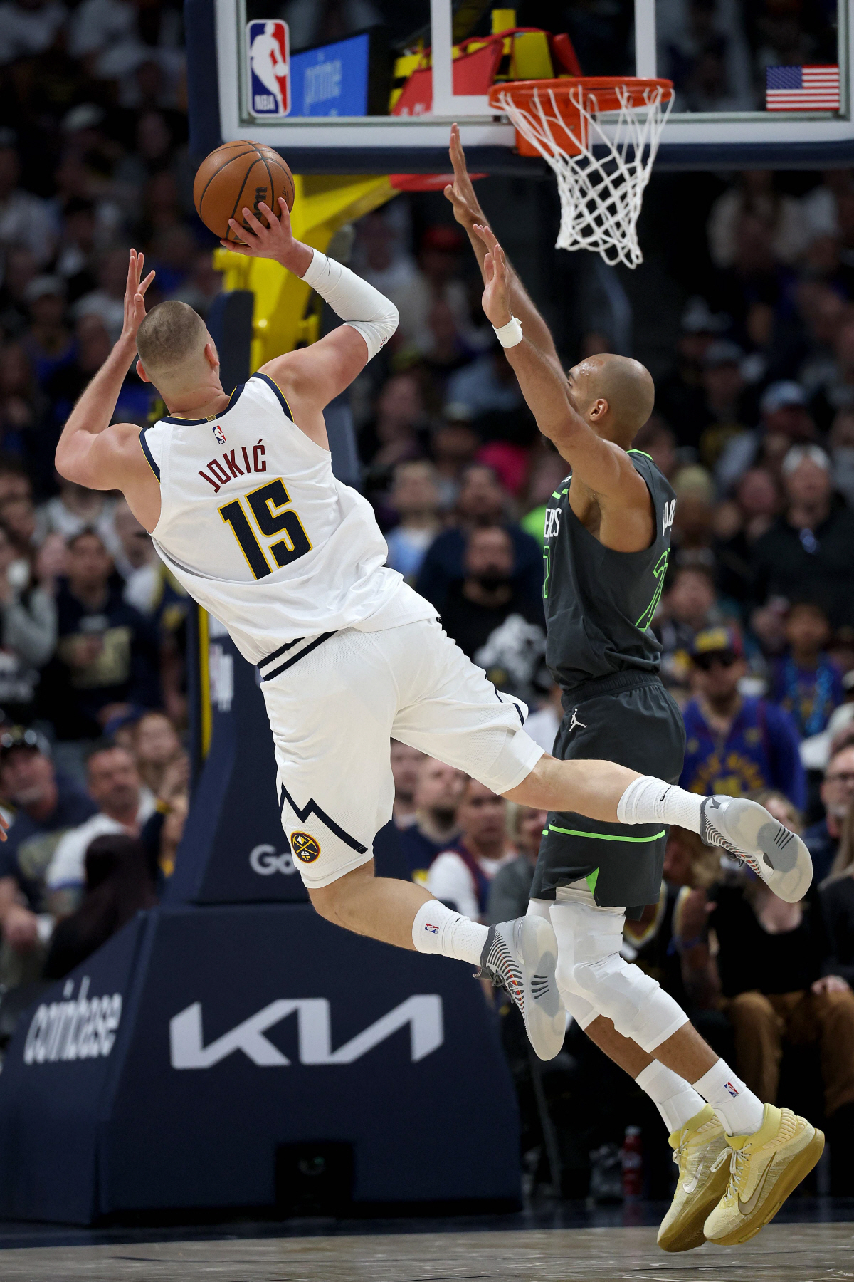 DENVER, COLORADO - APRIL 18: Nikola Jokic #15 of the Denver Nuggets puts up a shot against Rudy Gobert #27 of the Minnesota Timberwolves in the fourth quarter during Game One of the First Round of the NBA Western Conference Playoffs at Ball Arena on April 18, 2026 in Denver, Colorado. NOTE TO USER: User expressly acknowledges and agrees that, by downloading and or using this photograph, User is consenting to the terms and conditions of the Getty Images License Agreement. Matthew Stockman/Getty Images/AFP (Photo by MATTHEW STOCKMAN / GETTY IMAGES NORTH AMERICA / Getty Images via AFP)