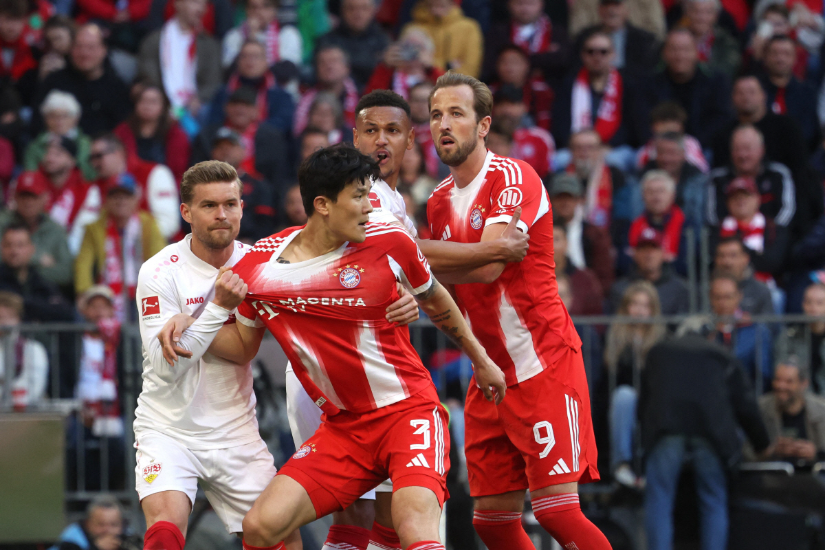 Stuttgart's German defender #07 Maximilian Mittelstaedt (L), Bayern Munich's South Korean defender #03 KimaMin-Jae, Stuttgart's Swiss defender #14 Luca Jaquez (2nd R) and Bayern Munich's English forward #09 Harry Kane (R) vie for the ball during the German first division Bundesliga football match between FC Bayern Munich and VfB Stuttgart in Munich, southern Germany, on April 19, 2026. (Photo by Karl-Josef HILDENBRAND / AFP) / DFL REGULATIONS PROHIBIT ANY USE OF PHOTOGRAPHS AS IMAGE SEQUENCES AND/OR QUASI-VIDEO