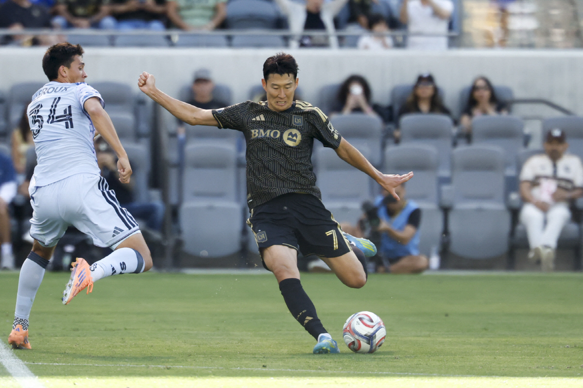 Apr 19, 2026; Los Angeles, California, USA; Los Angeles Football Club forward Son Heung-Min (7) kicks the ball during the first period against the San Jose Earthquakes at BMO Stadium. Mandatory Credit: William Navarro-Imagn Images