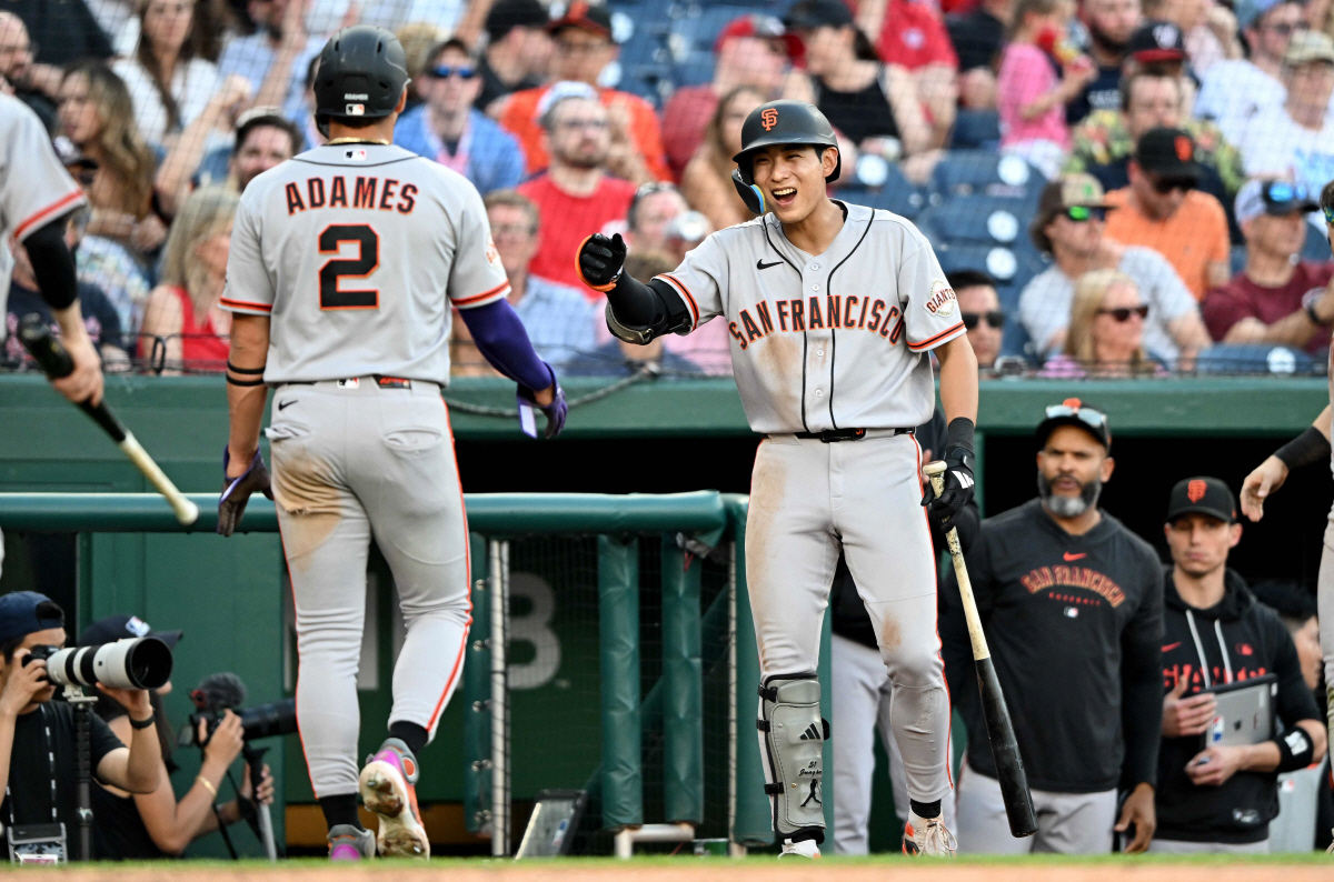 WASHINGTON, DC - APRIL 18: Willy Adames #2 of the San Francisco Giants celebrates with Jung Hoo Lee #51 after scoring in the seventh inning against the Washington Nationals at Nationals Park on April 18, 2026 in Washington, DC. Greg Fiume/Getty Images/AFP (Photo by Greg Fiume / GETTY IMAGES NORTH AMERICA / Getty Images via AFP)