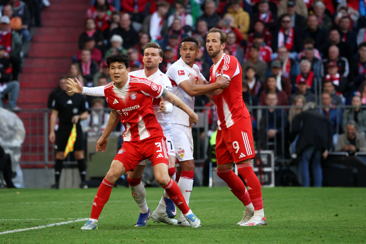 Bayern Munich's South Korean defender #03 KimaMin-Jae (L), Stuttgart's German defender #07 Maximilian Mittelstaedt (2nd L), Stuttgart's Swiss defender #14 Luca Jaquez (2nd R) and Bayern Munich's English forward #09 Harry Kane (R) vie for the ball during the German first division Bundesliga football match between FC Bayern Munich and VfB Stuttgart in Munich, southern Germany, on April 19, 2026. (Photo by Karl-Josef HILDENBRAND / AFP) / DFL REGULATIONS PROHIBIT ANY USE OF PHOTOGRAPHS AS IMAGE SEQUENCES AND/OR QUASI-VIDEO