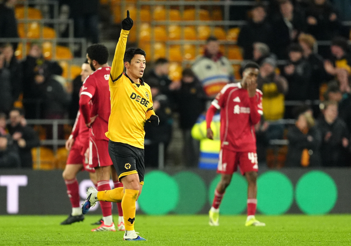 Wolverhampton Wanderers' Hwang Hee-Chan, front, celebrates afte scoring during an English FA Cup fifth round match against Liverpool, Friday, March 6, 2026, in Wolverhampton, England. (Martin Rickett/PA via AP) UNITED KINGDOM OUT; NO SALES; NO ARCHIVE; PHOTOGRAPH MAY NOT BE STORED OR USED FOR MORE THAN 14 DAYS AFTER THE DAY OF TRANSMISSION; MANDATORY CREDIT