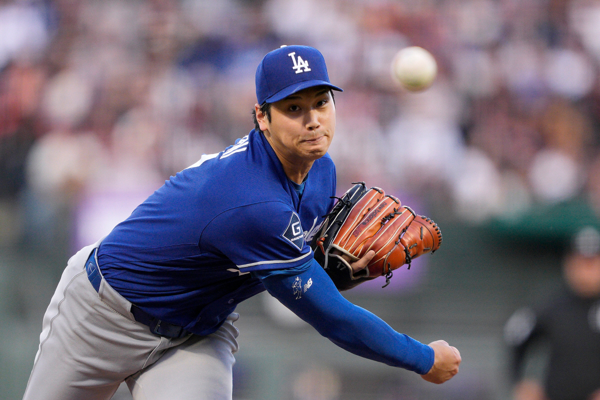 Los Angeles Dodgers pitcher Shohei Ohtani throws to a San Francisco Giants batter during the second inning of a baseball game Wednesday, April 22, 2026, in San Francisco. (AP Photo/Tony Avelar)