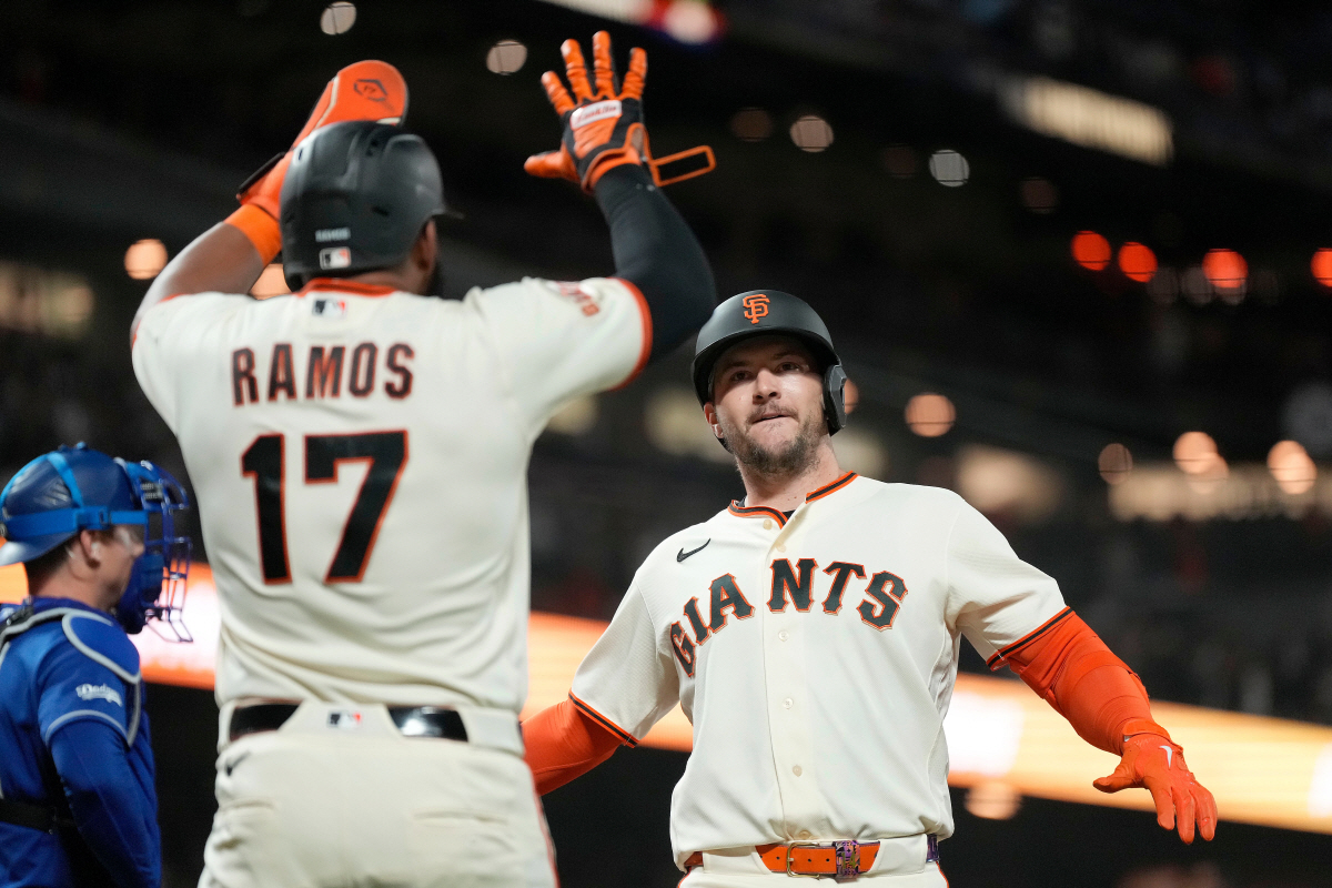 San Francisco Giants' Patrick Bailey, right celebrates with Heliot Ramos (17) after hitting a three-run home run during the sixth inning of a baseball game against the Los Angeles Dodgers, Wednesday, April 22, 2026, in San Francisco. (AP Photo/Tony Avelar)